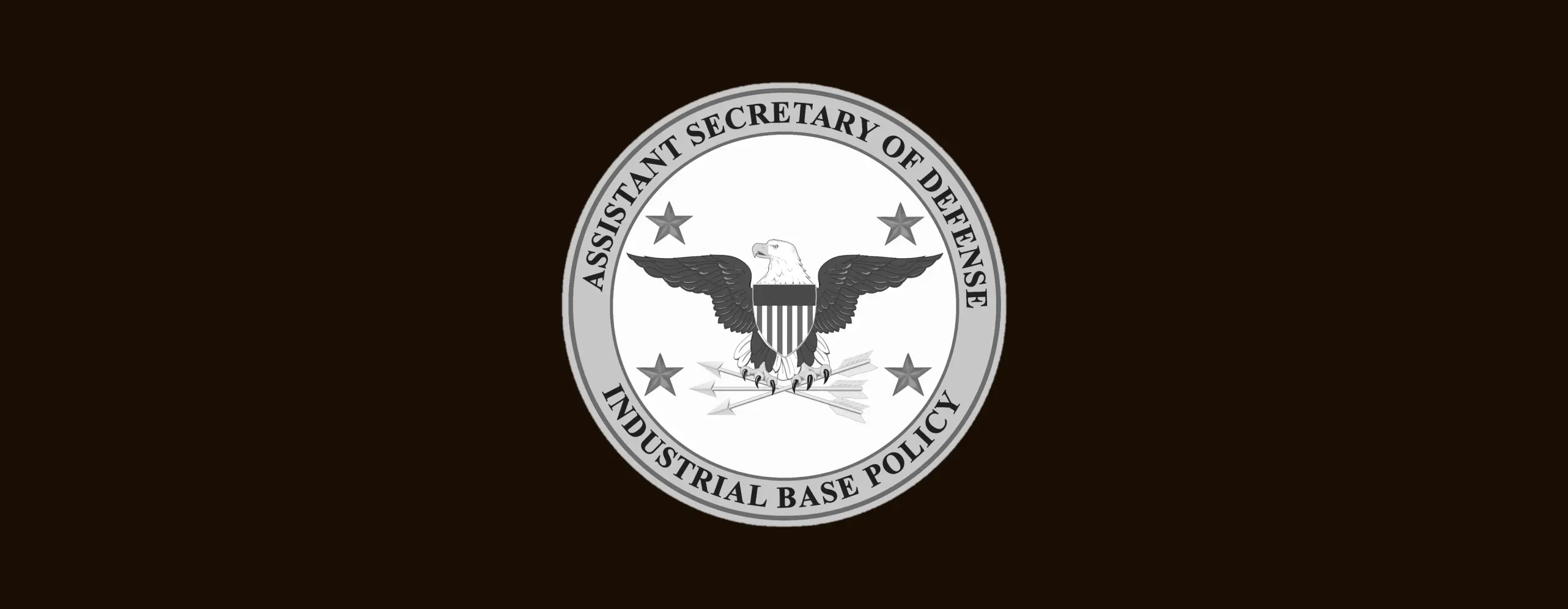 Seal of Assistant Secretary of Defense Industrial Base Policy with eagle, arrows, and four stars on black background.
