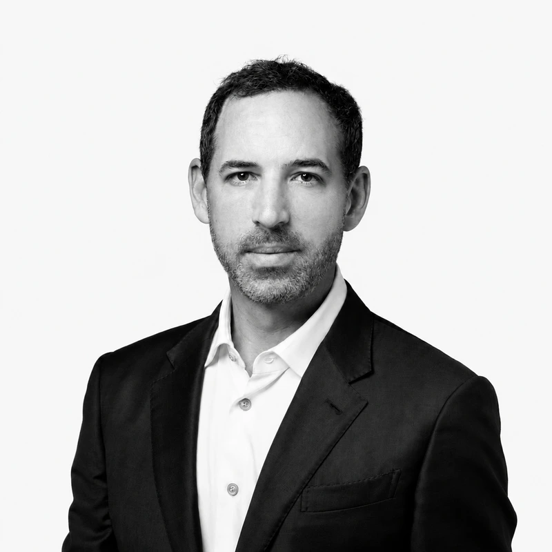 A black and white headshot of Michael Blitzer.