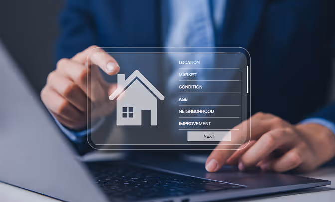 Person using laptop with virtual housing market interface showing location, age, and neighborhood fields.