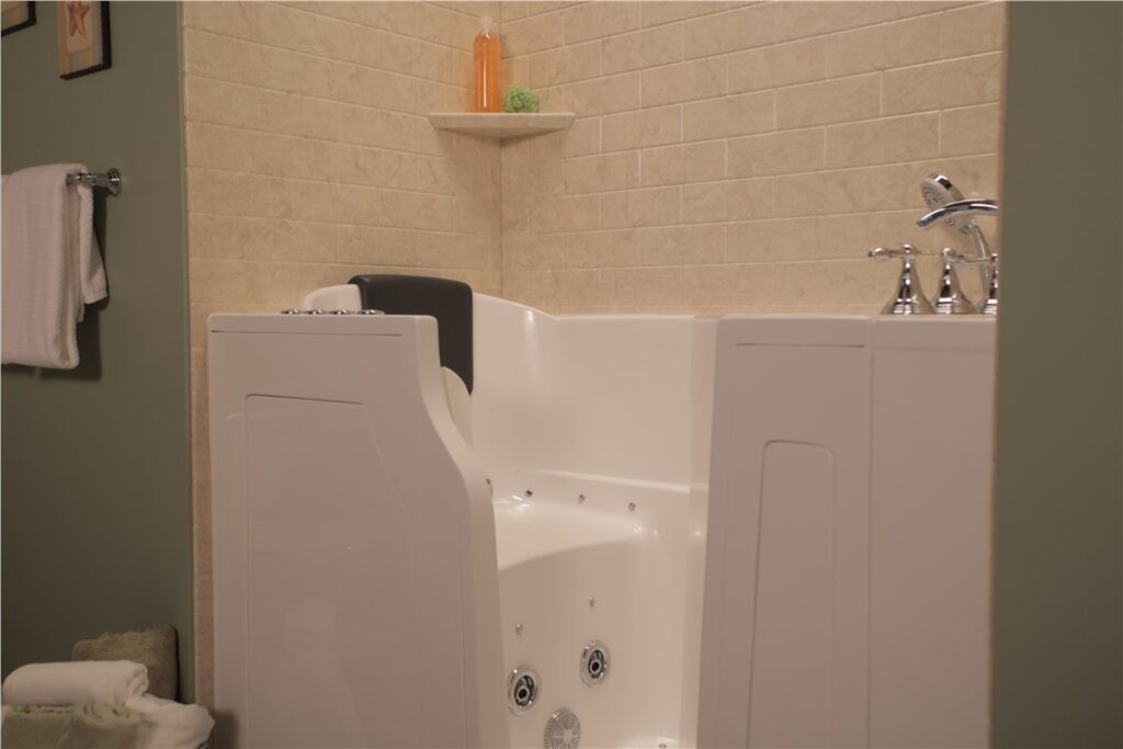 White walk-in tub with beige brick wall surround