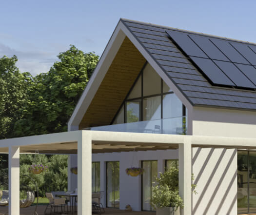 Modern house with solar panels on the roof, large glass windows, and an outdoor patio with plants and hanging baskets.