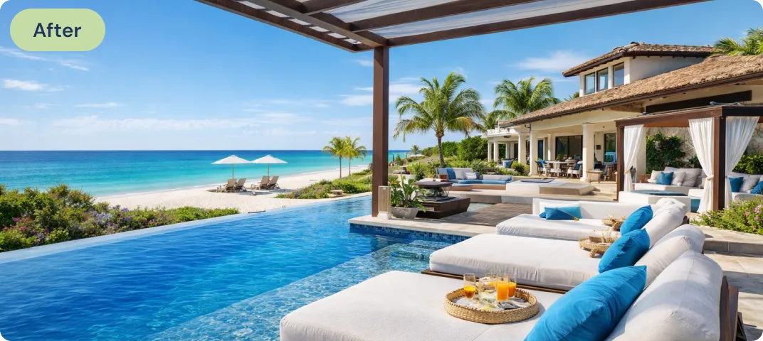 Luxury beachfront villa with an infinity pool, lounge chairs with blue pillows, palm trees, and ocean view under a clear sky.