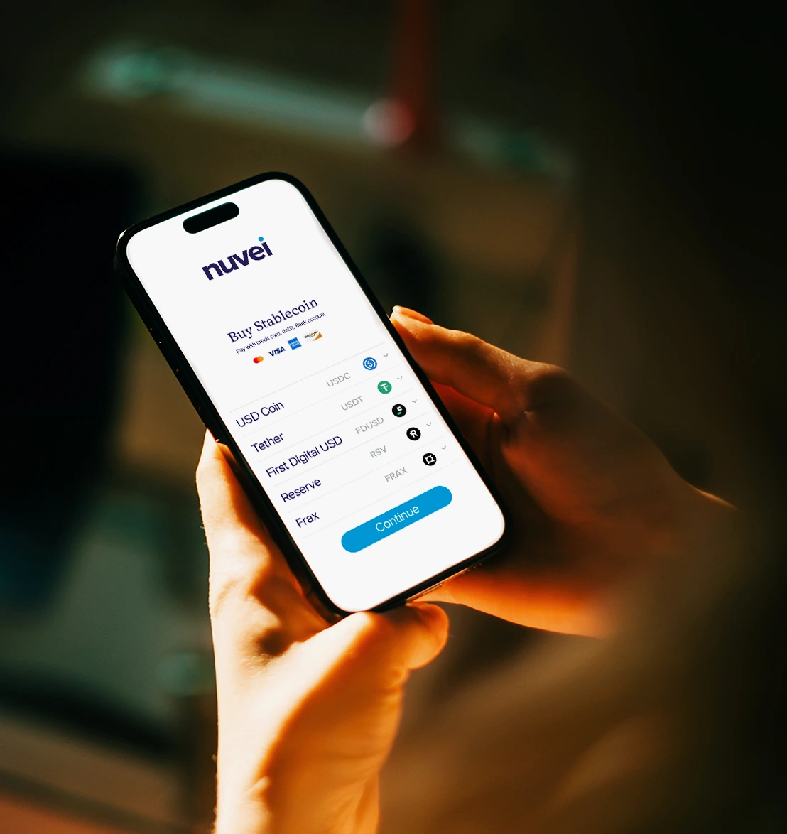 Phone showing a Nuvei screen to buy stablecoins such as USDC and Tether