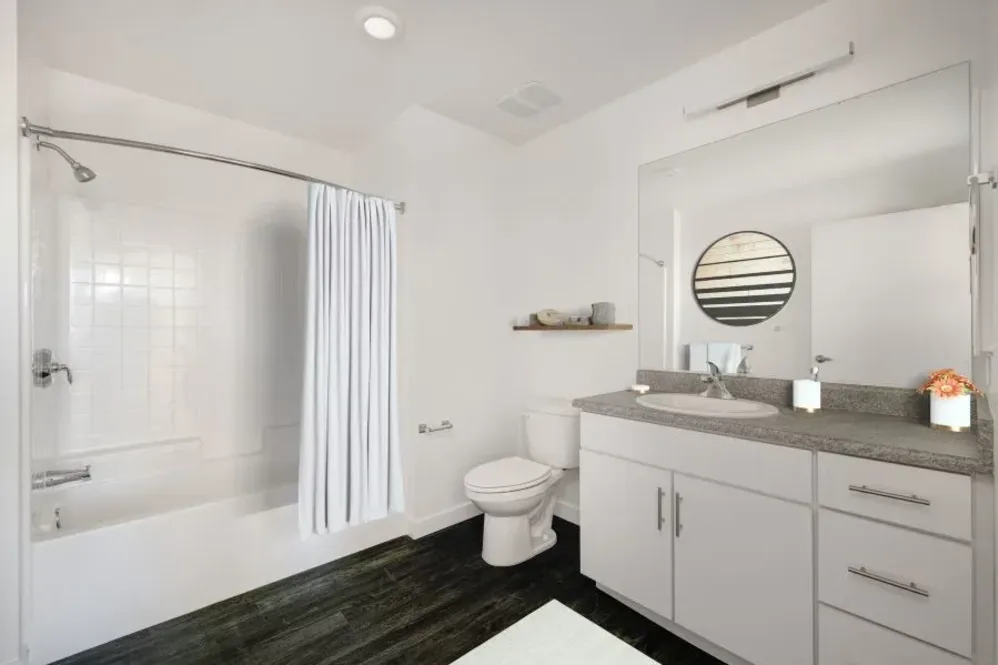 Bathroom with white cabinets and shower tub combo