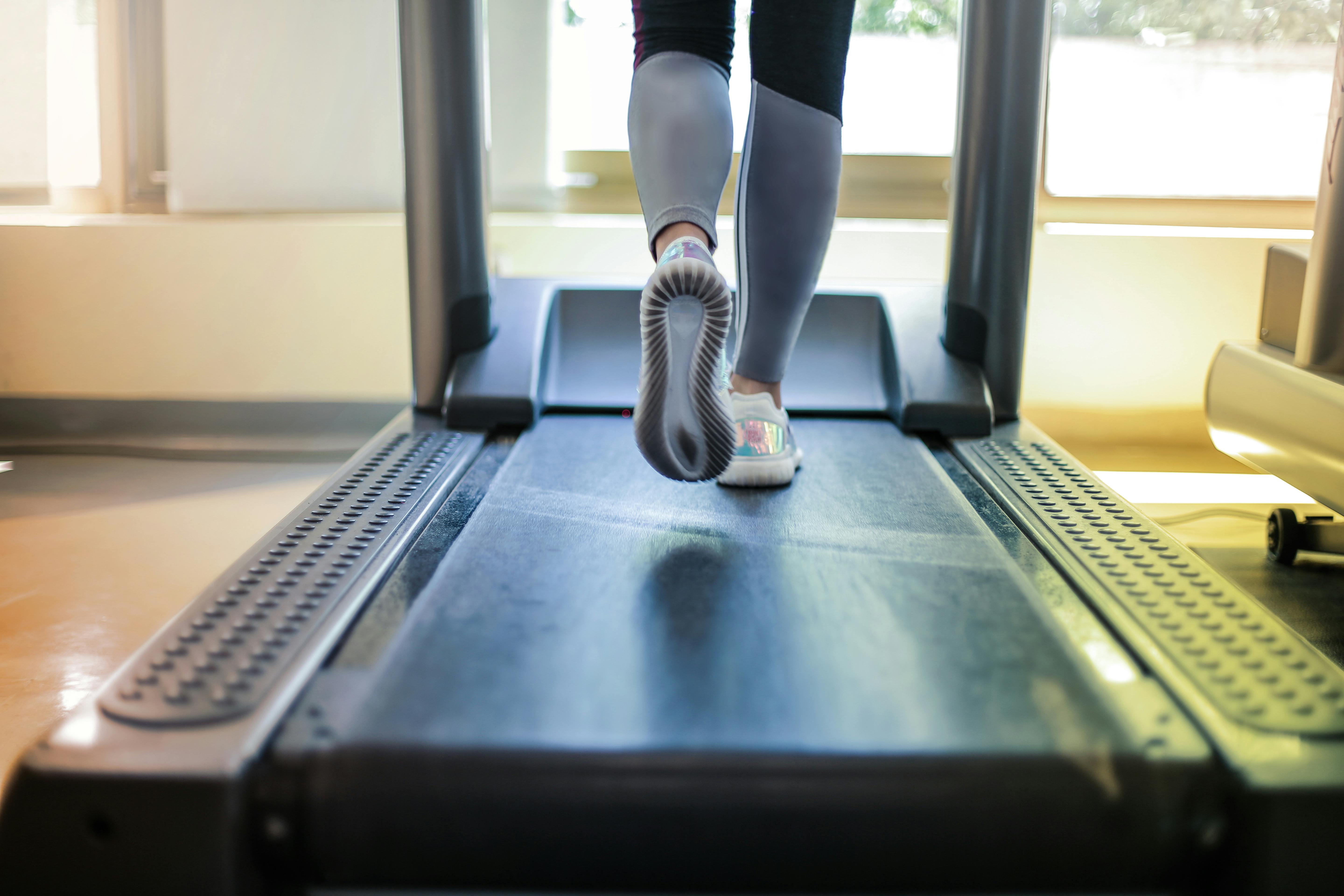 Feet on treadmill stock photo