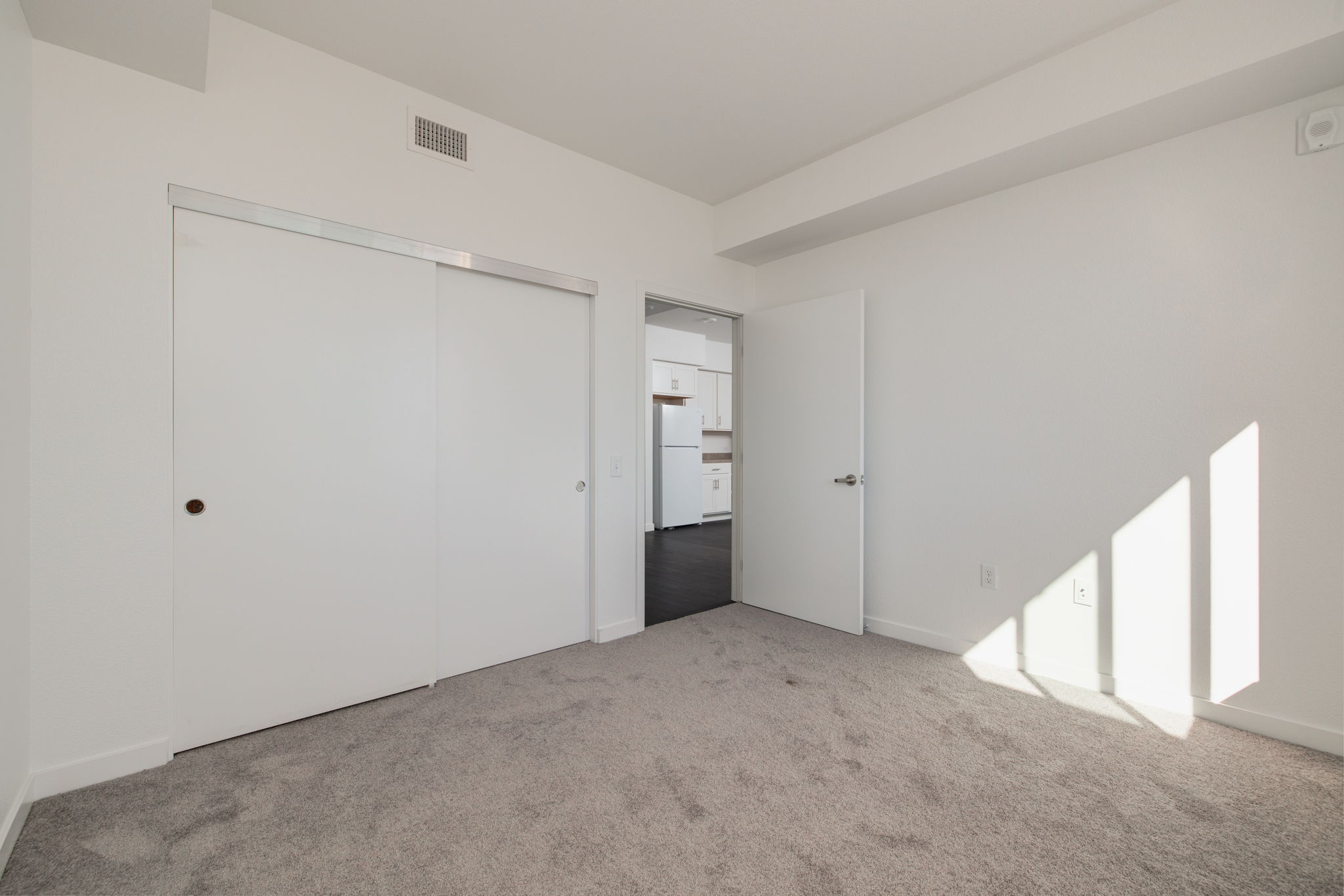Unfurnished bedroom with carpet