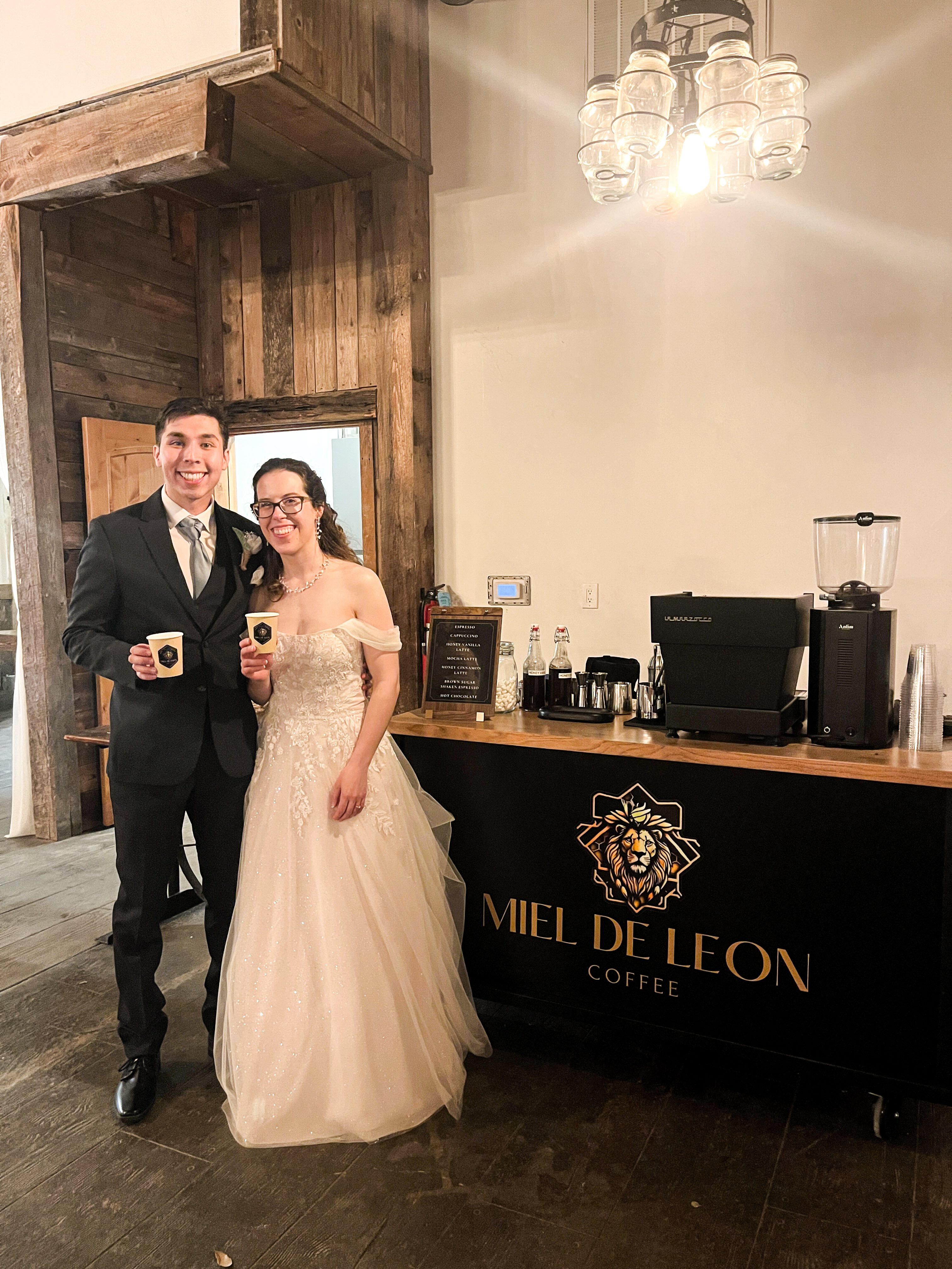 Bride and groom enjoying Miel De Leon Coffee espresso bar catering at their San Antonio wedding reception