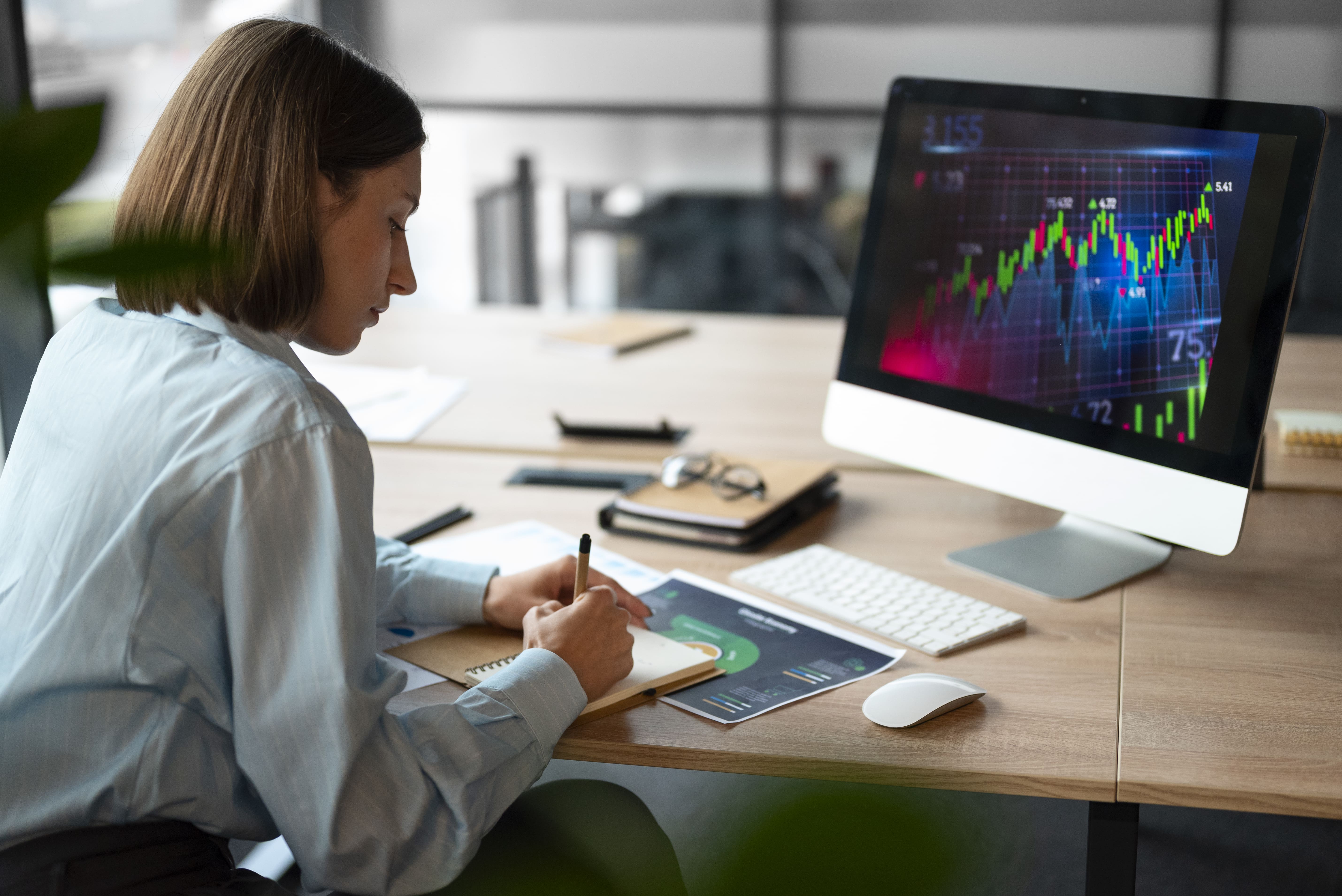 woman analysing graphs on a screen