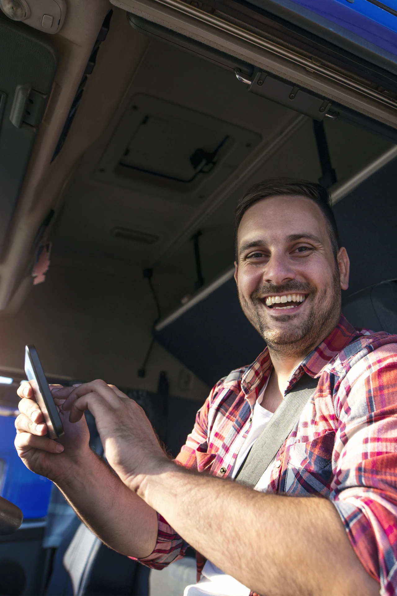 Happy truck driver using TMS software