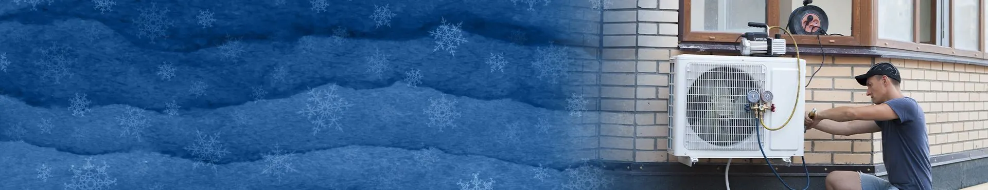 Technician in shorts and cap working on an outdoor air conditioning unit mounted on a brick wall with snowflake graphics on the left side.