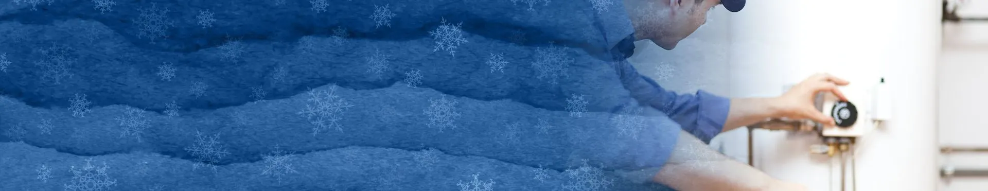 Person adjusting the temperature control knob on a white water heater.