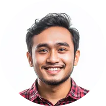 A man with a beard smiling.