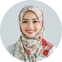 A woman wearing a headscarf and smiling.