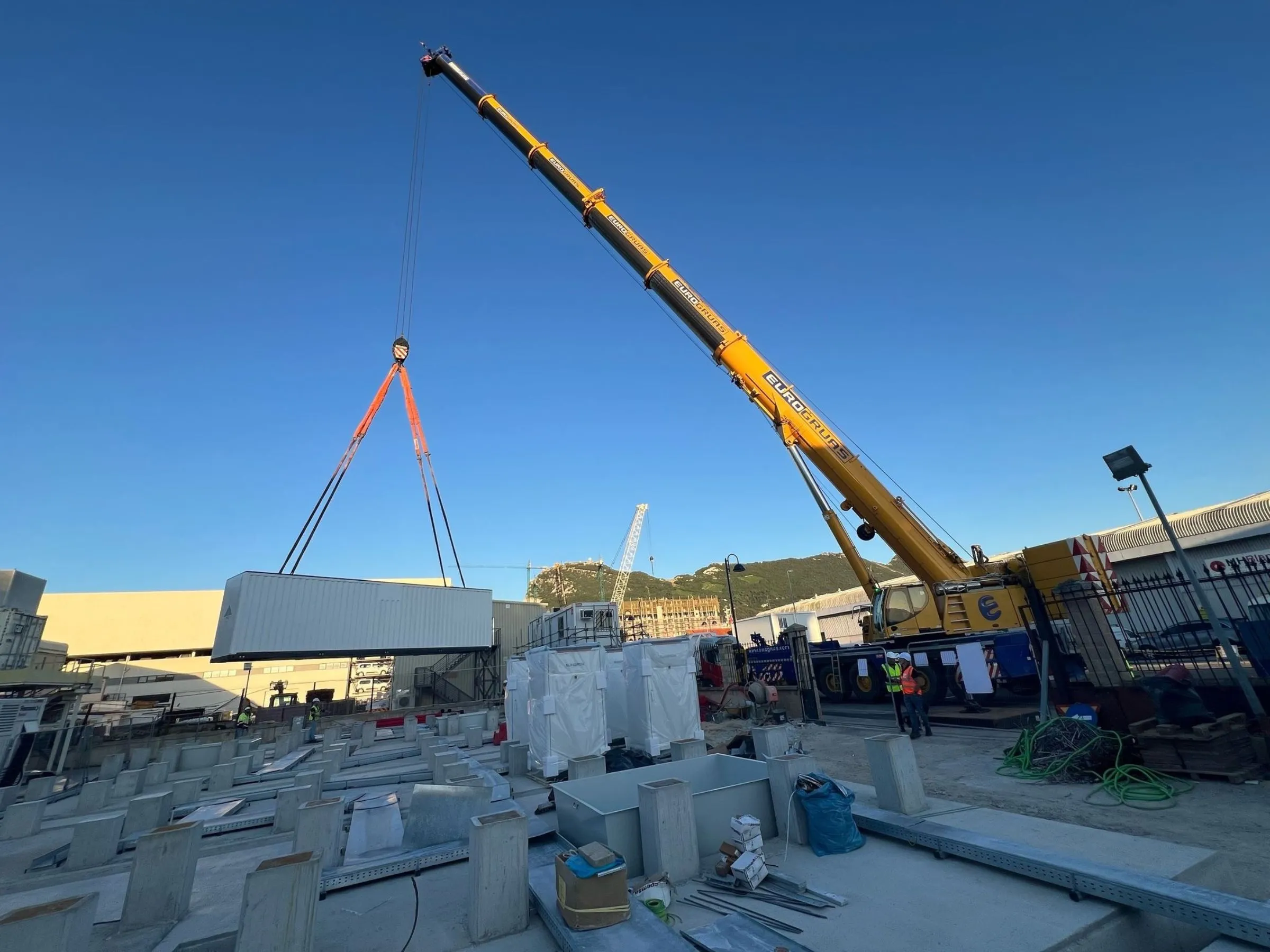 Crane lifting battery storage unit for Gibraltar power grid integration project