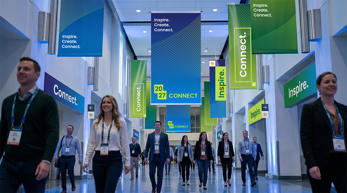 people walking through convention center to their next breakout session