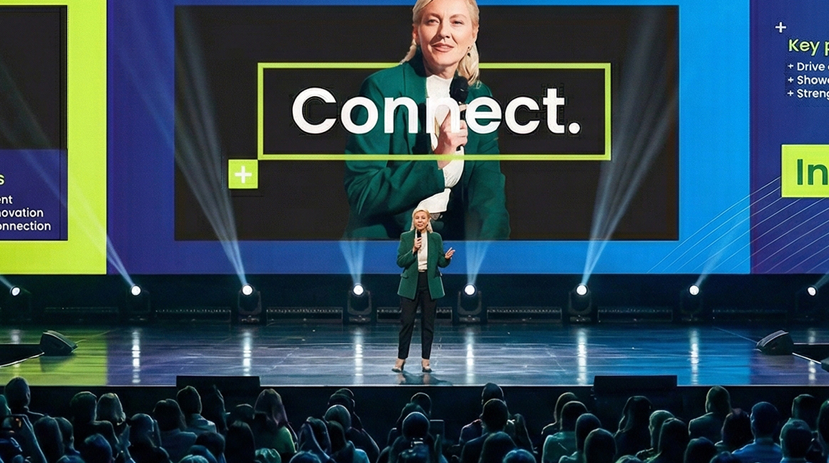 close up of female key speaker on stage during General Session