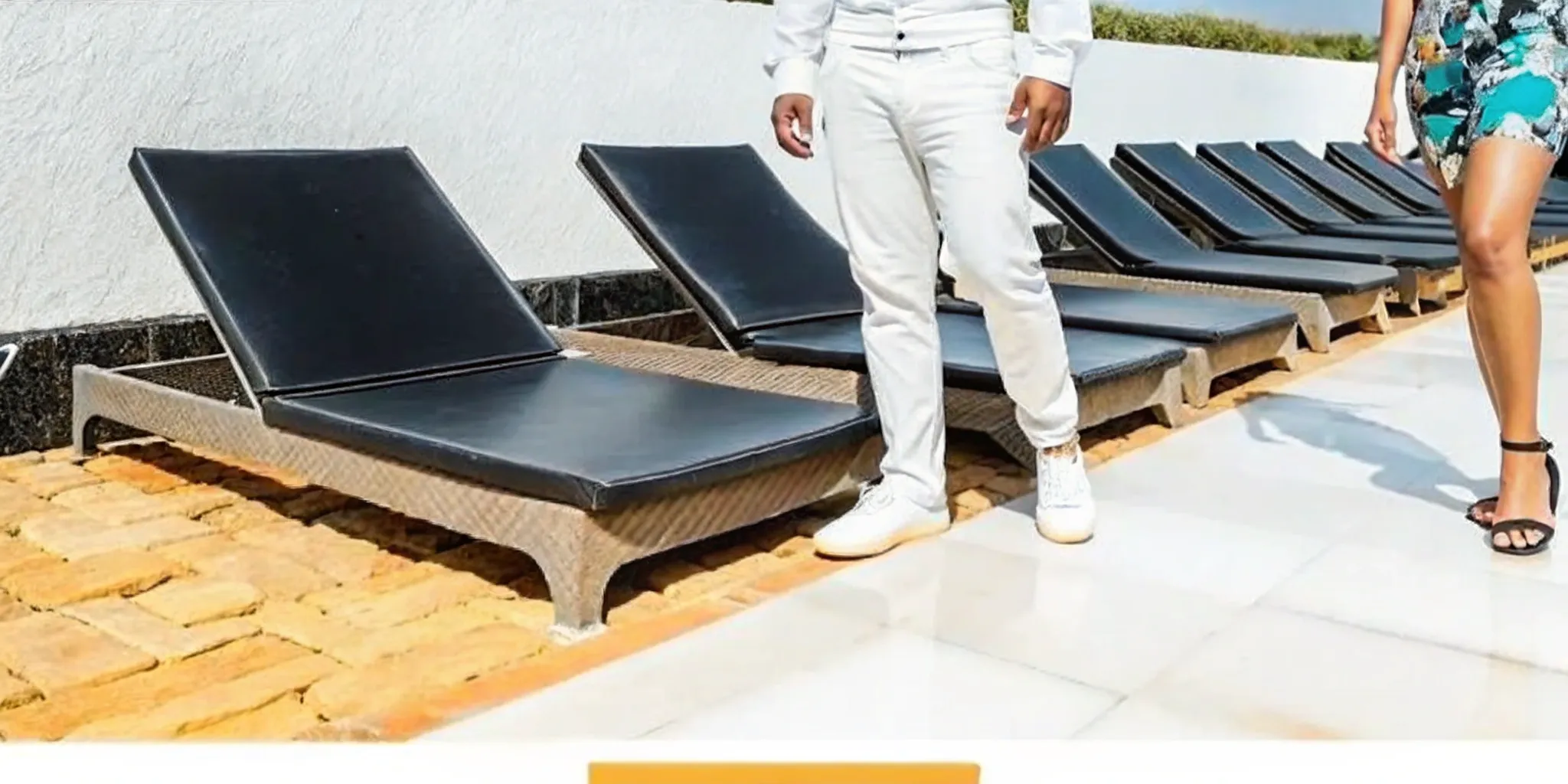A modern poolside patio with lounge chairs on durable 2cm porcelain pavers.