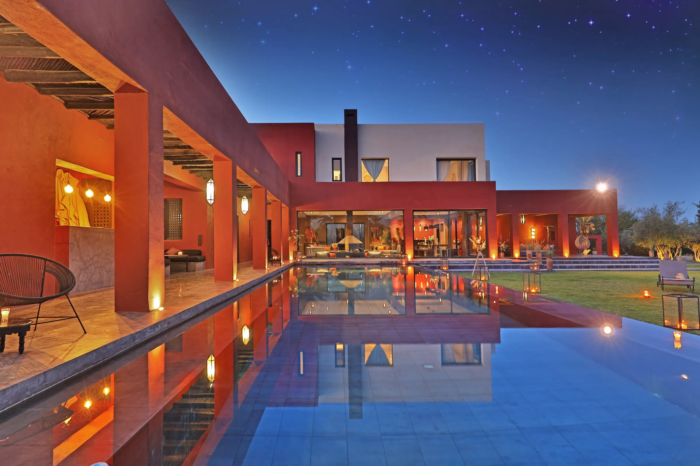 Private villa and pool lit up at night near Marrakech
