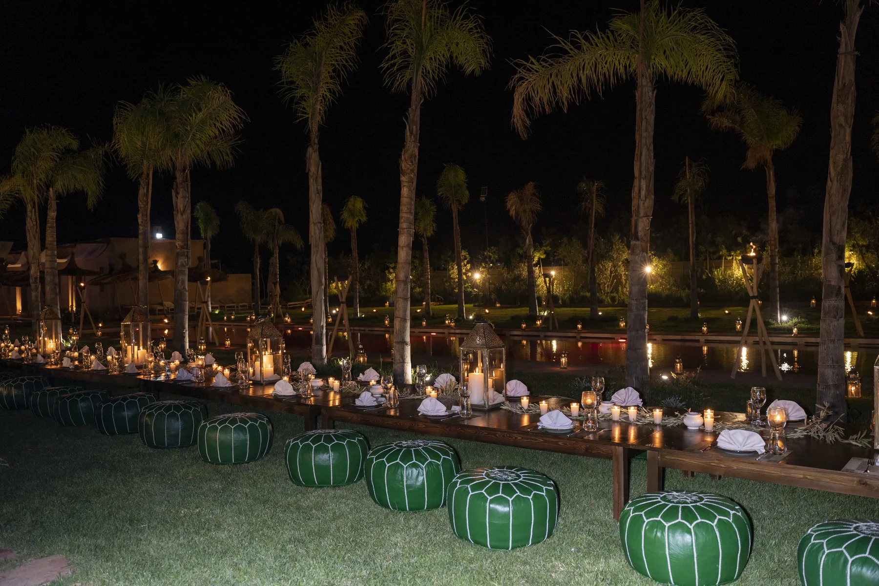 Villa Moira, celebration villa in the Palmeraie, Marrakech, candlelit celebration in the gardens. The Marrakech Curator.