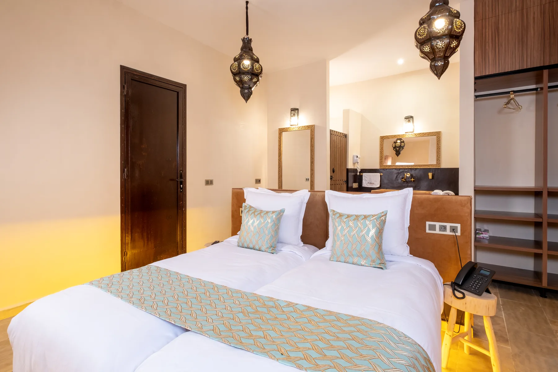 Villa Moira, celebration villa in the Palmeraie, Marrakech, warm suite bedroom. The Marrakech Curator.