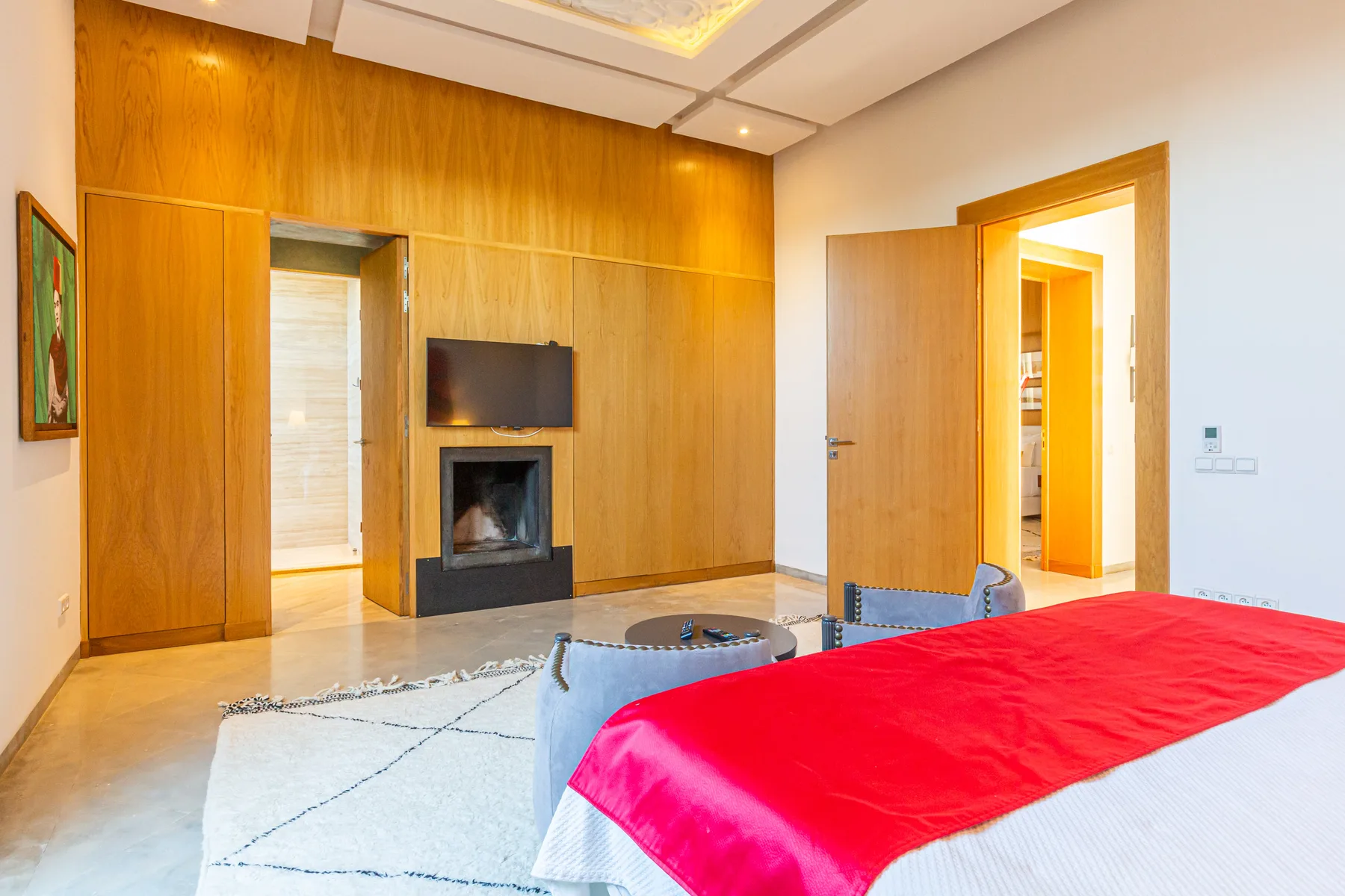 Villa Zephyra, 5 bedroom villa for rent in Marrakech, master bedroom with fireplace. The Marrakech Curator.