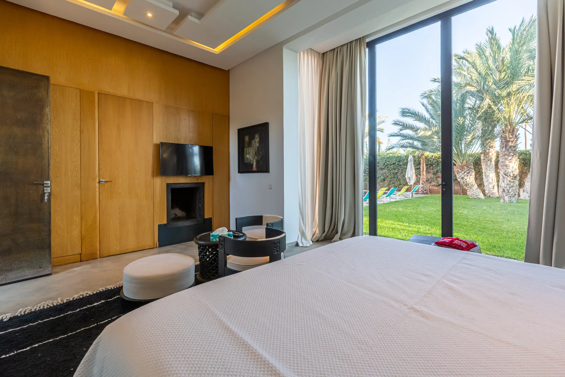 Villa Zephyra, 5 bedroom villa for rent in Marrakech, suite with fireplace and garden view. The Marrakech Curator.