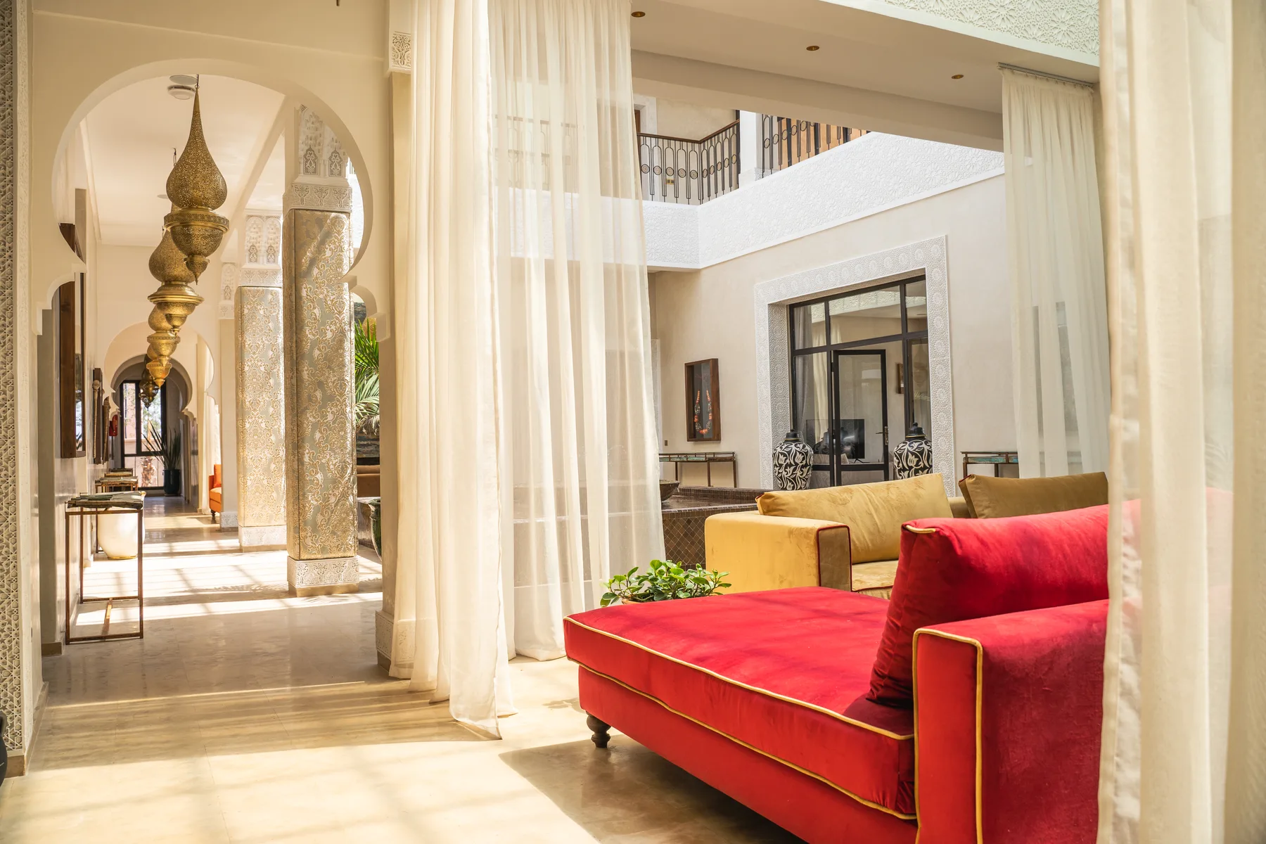 Villa Kallista, 12 bedroom wedding and event villa in Marrakech, gallery lounge under the arches. The Marrakech Curator.
