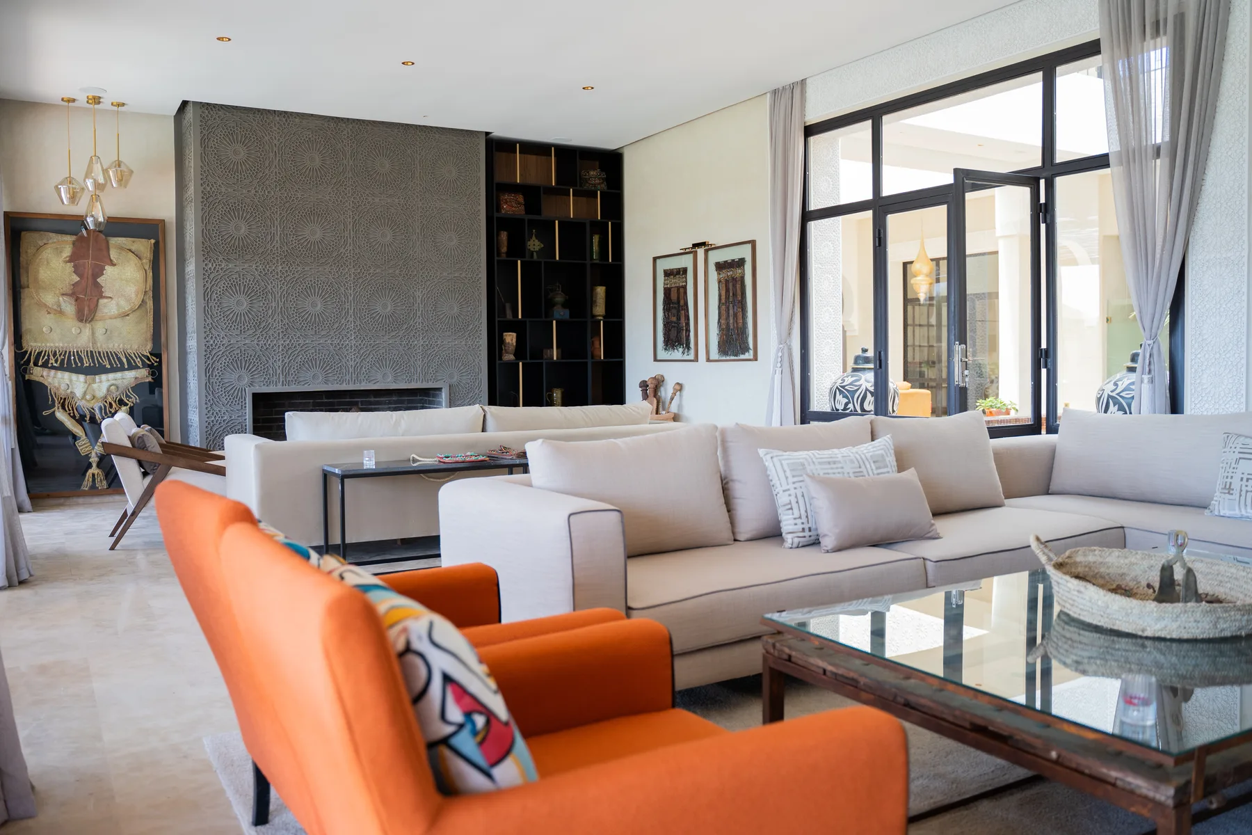 Villa Kallista, 12 bedroom wedding and event villa in Marrakech, white salon with fireplace. The Marrakech Curator.
