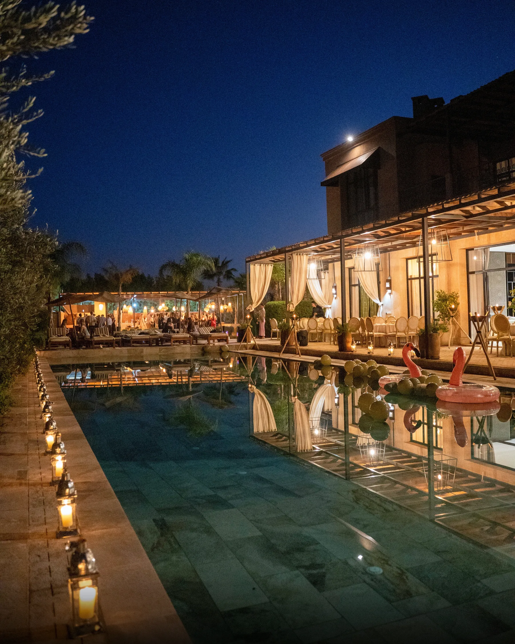 Villa Kallista, 12 bedroom wedding and event villa in Marrakech, evening reception around the pool. The Marrakech Curator.