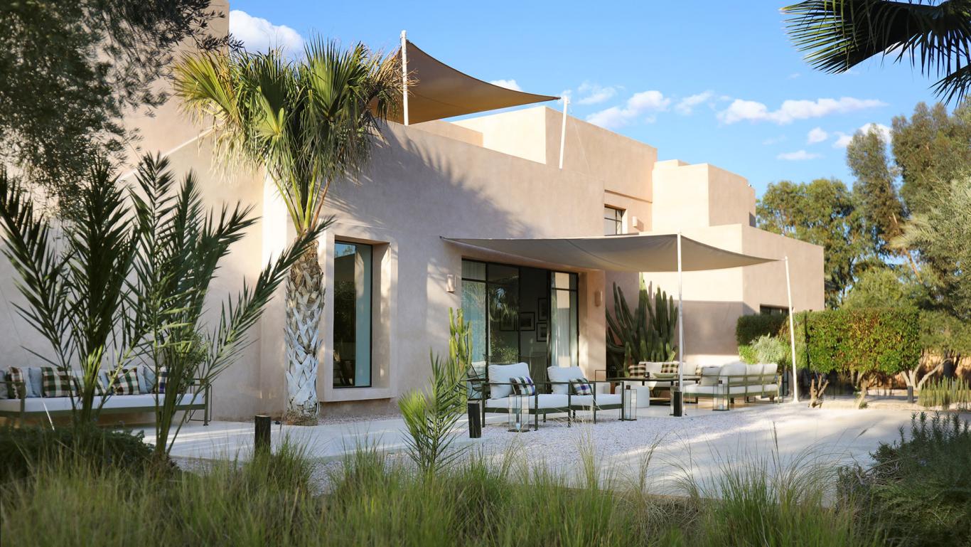 Villa Eos, private villa rental in the Palmeraie, Marrakech: villa facade and shaded terrace