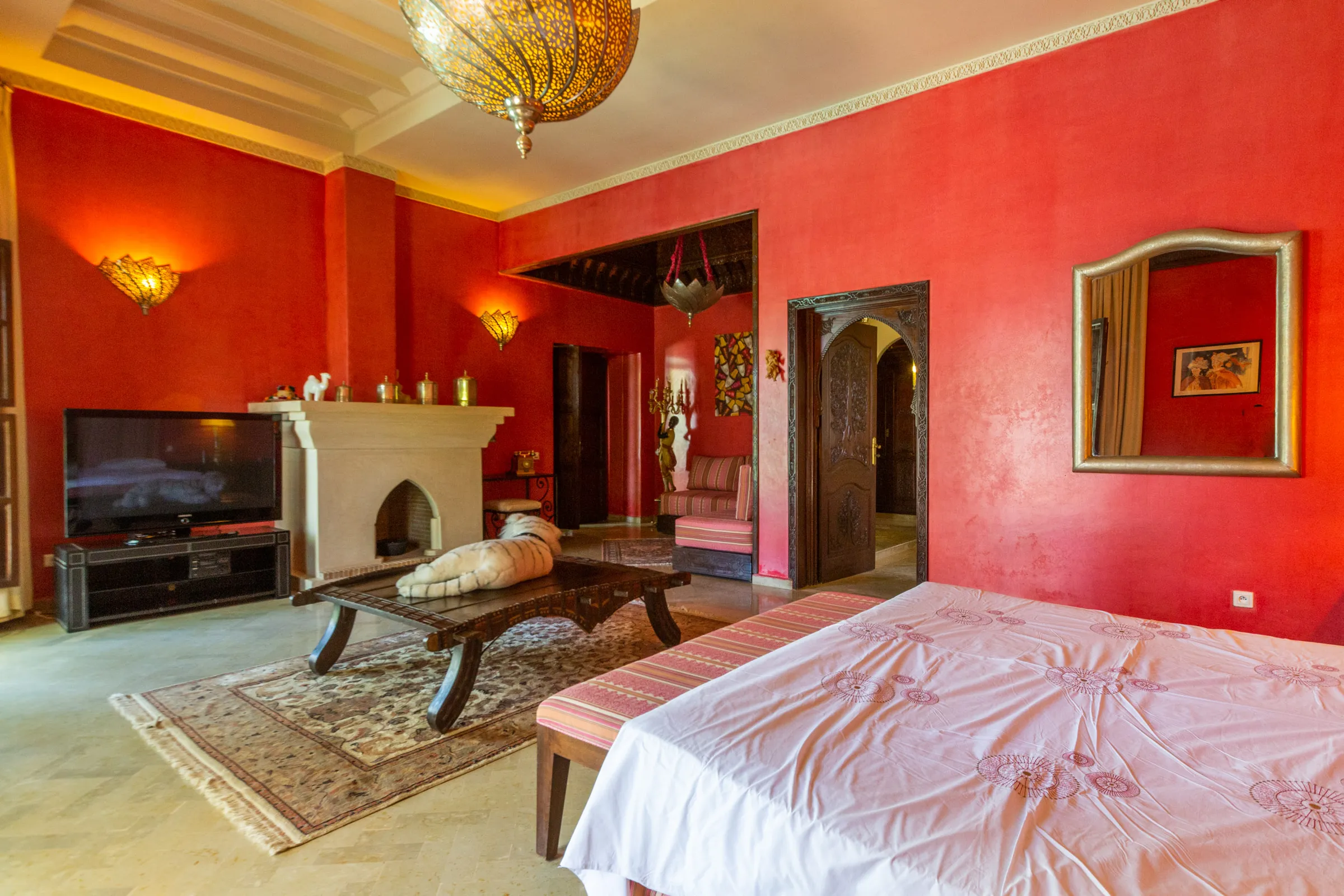 Villa Aegea, private villa rental in the Palmeraie, Marrakech: red suite with fireplace