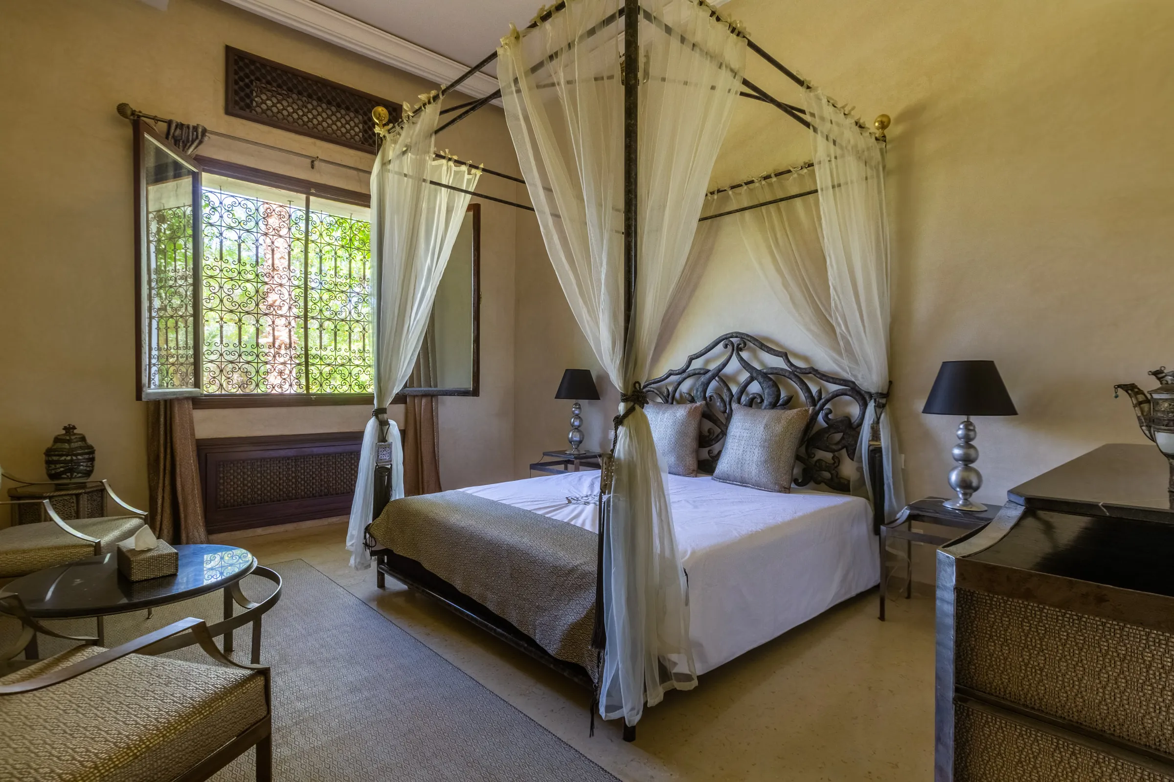 Villa Aegea, private villa rental in the Palmeraie, Marrakech: suite with four-poster bed