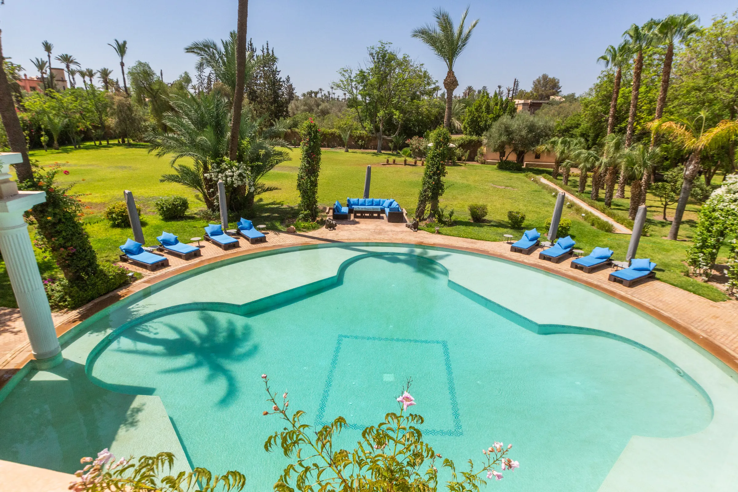 Villa Aegea, private villa rental in the Palmeraie, Marrakech: round pool among palm trees