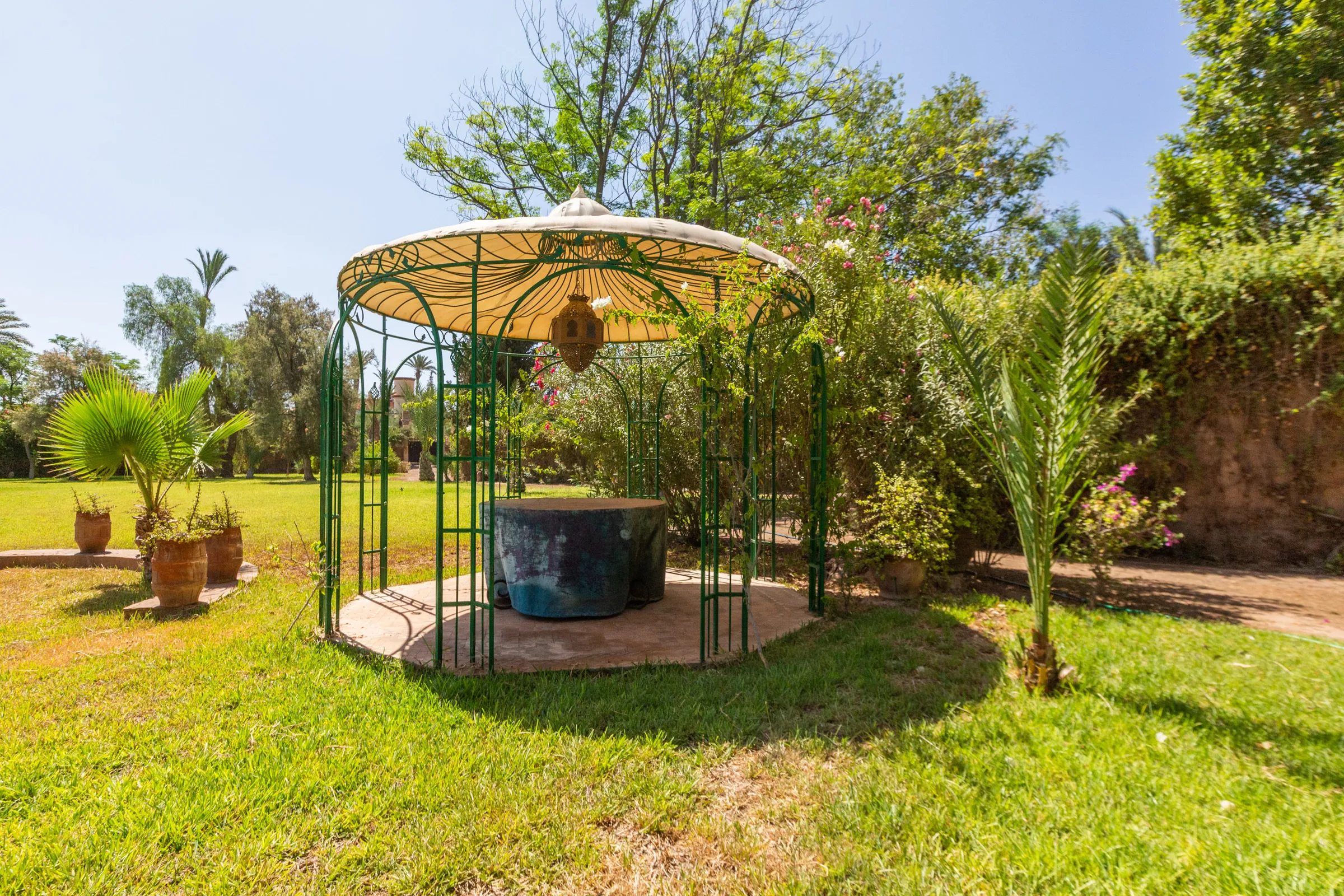 Villa Aegea, private villa rental in the Palmeraie, Marrakech: wrought-iron gazebo in the garden
