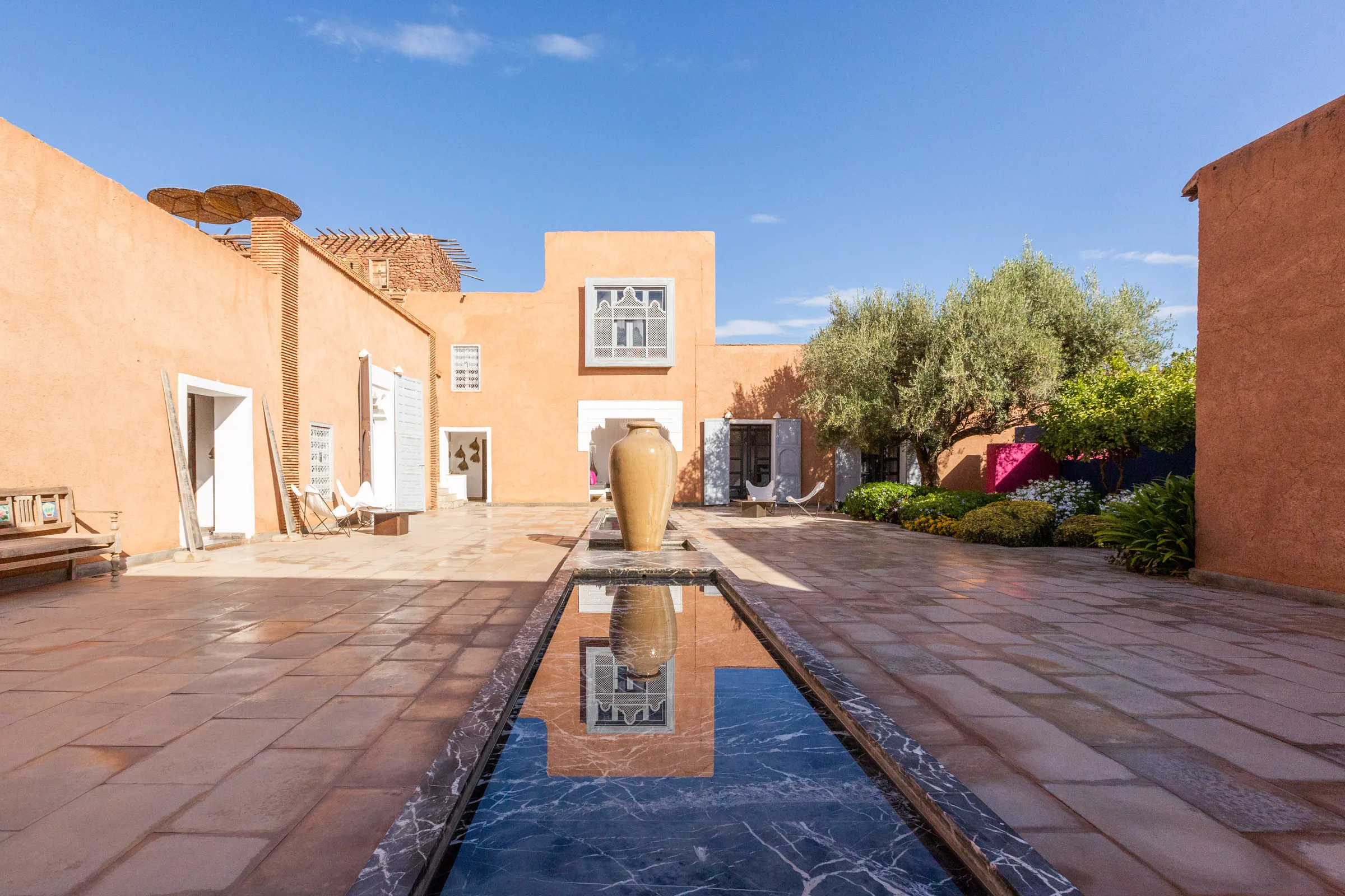 Villa Chloé, private estate rental in Sidi Abdellah Ghiat, Marrakech: kasbah courtyard with water basin