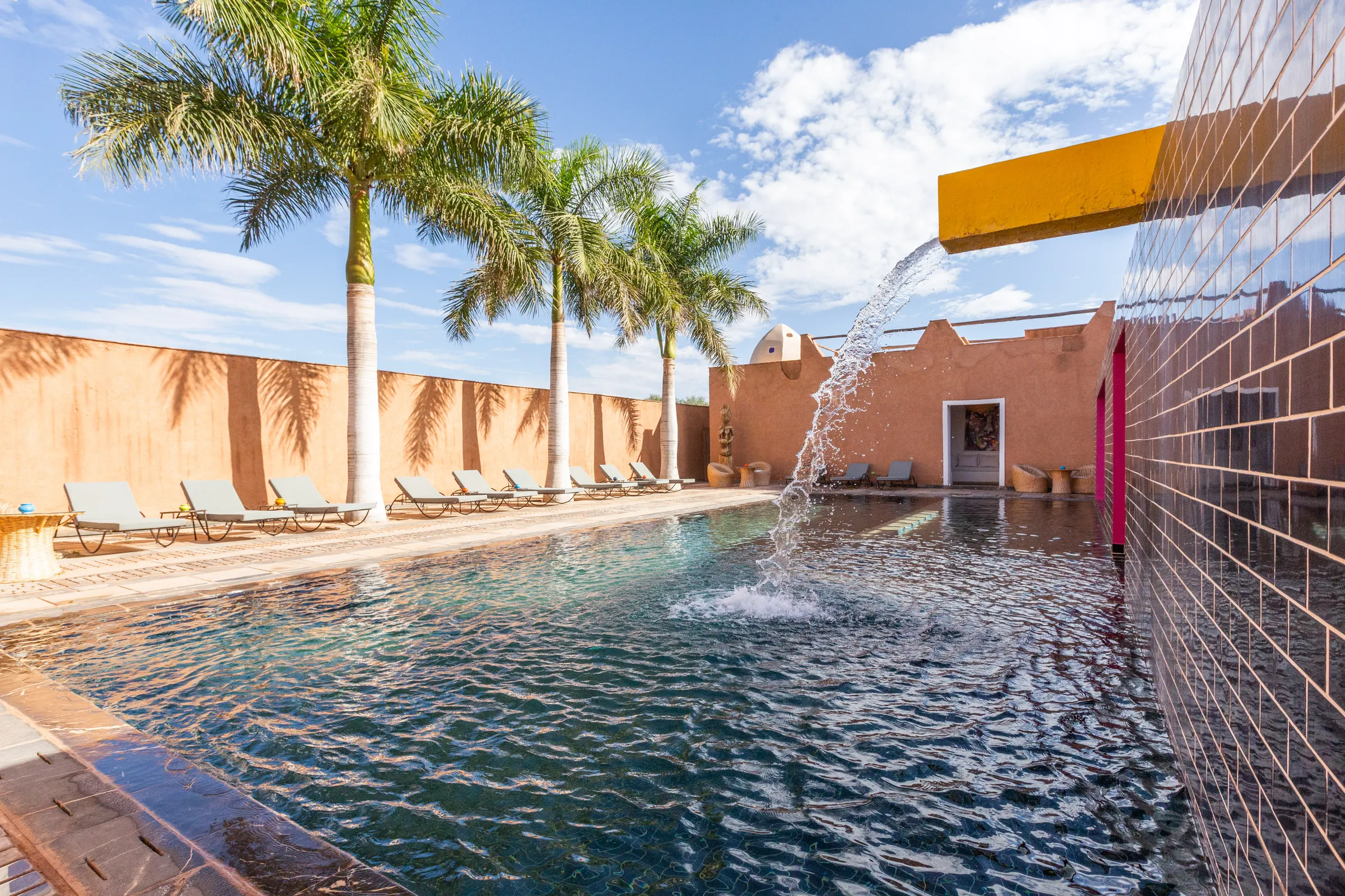 Villa Chloé, private estate rental in Sidi Abdellah Ghiat, Marrakech: pool and water feature by the kasbah