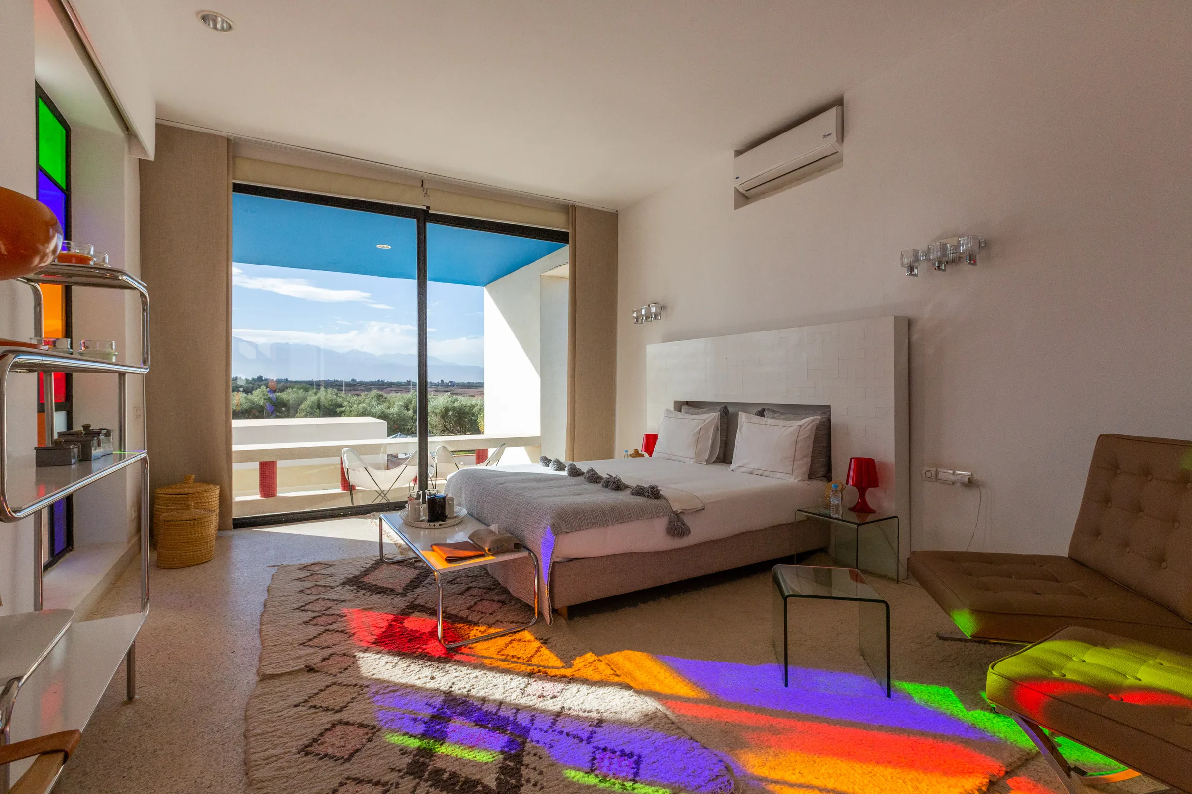 Villa Chloé, private estate rental in Sidi Abdellah Ghiat, Marrakech: contemporary suite with colourful decor