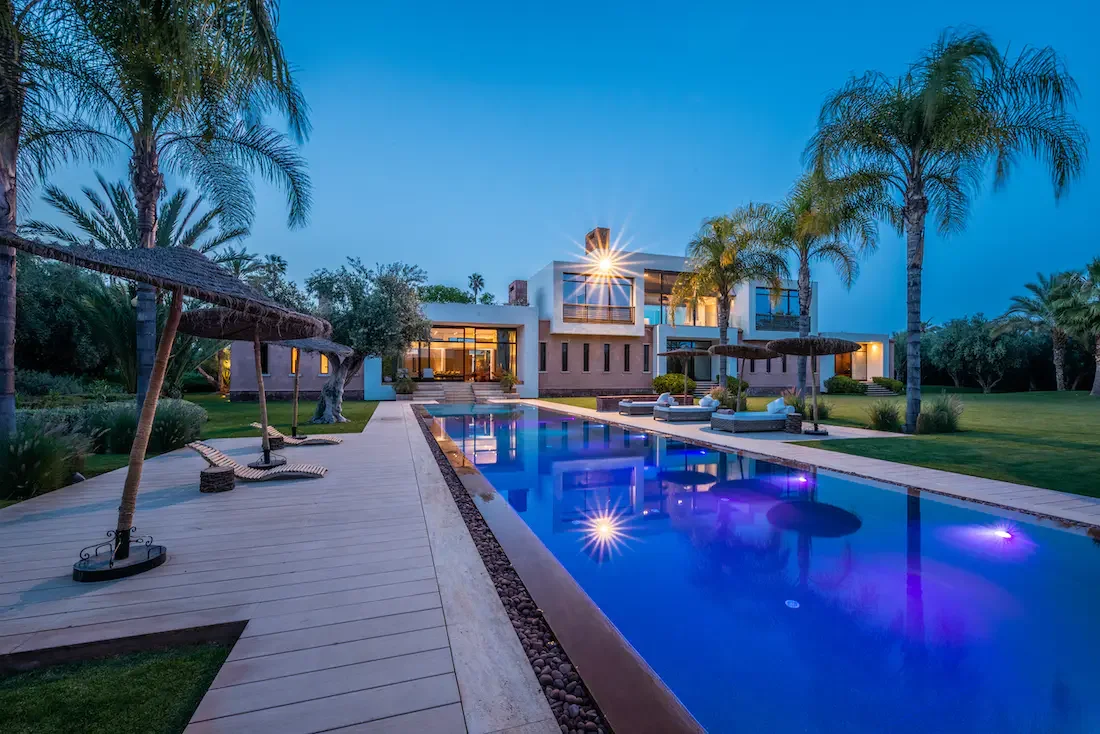 Villa Althea, private villa rental in Bab Atlas, Marrakech: pool lit up at dusk