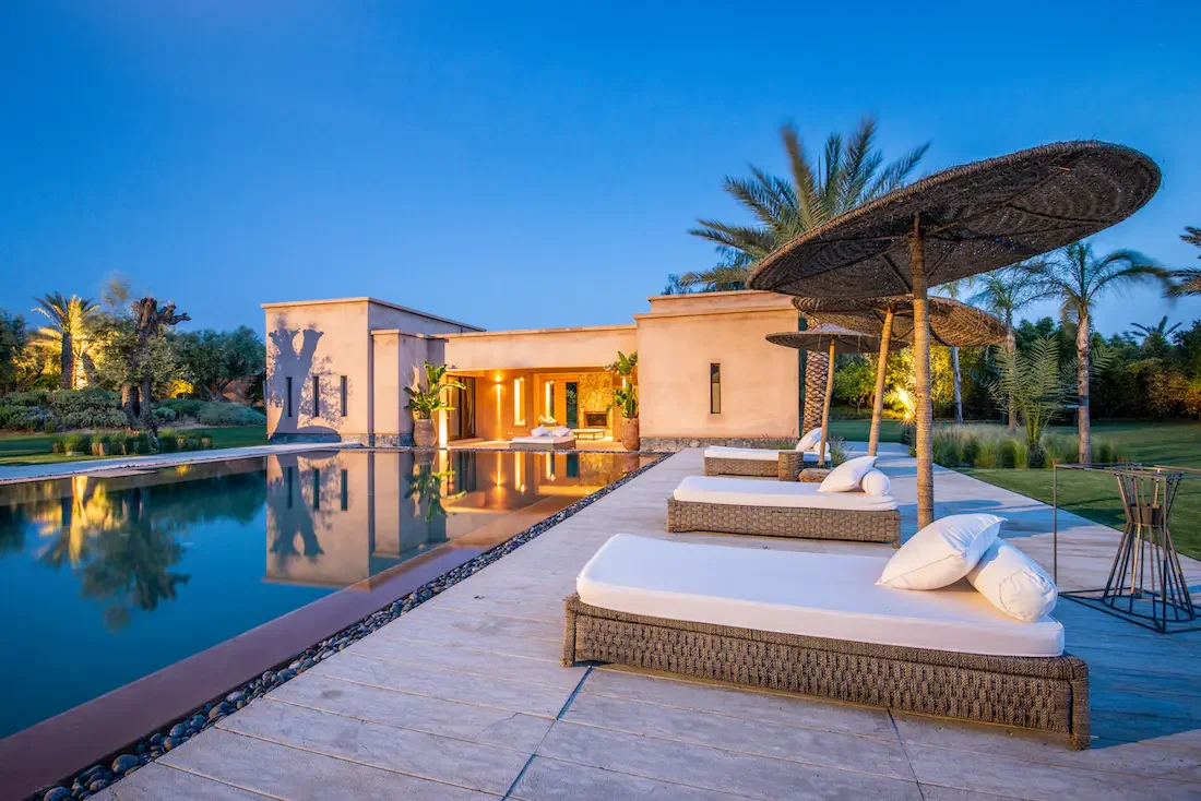 Villa Nerea, private villa rental in Bab Atlas, Marrakech: poolside daybed at dusk