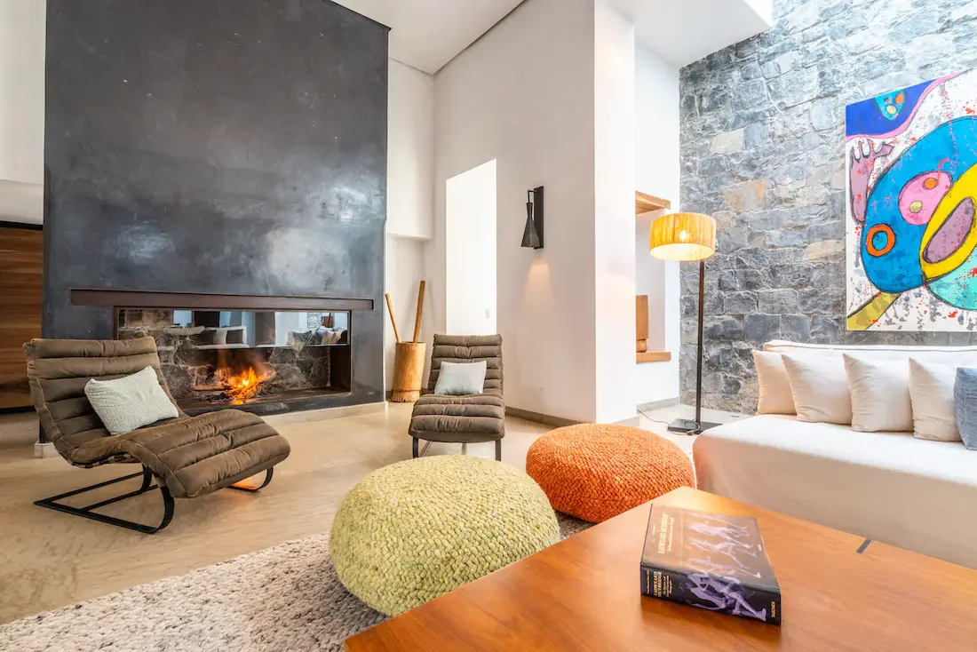 Villa Nerea, private villa rental in Bab Atlas, Marrakech: lounge with fireplace