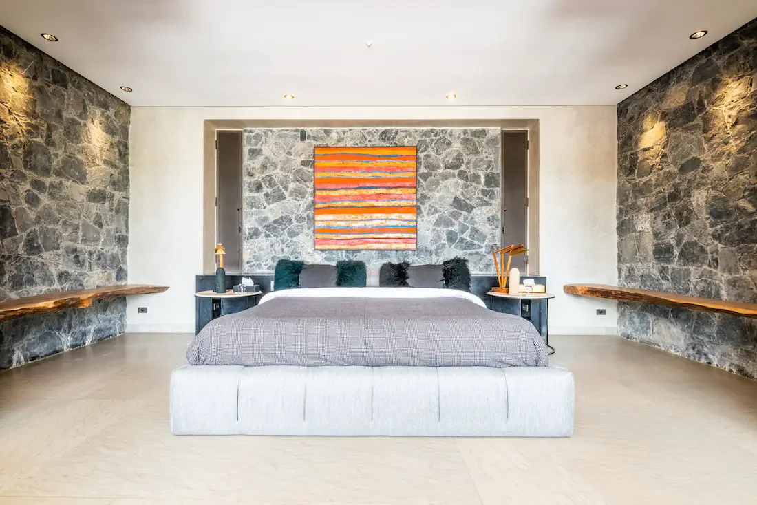Villa Nerea, private villa rental in Bab Atlas, Marrakech: suite with stone wall