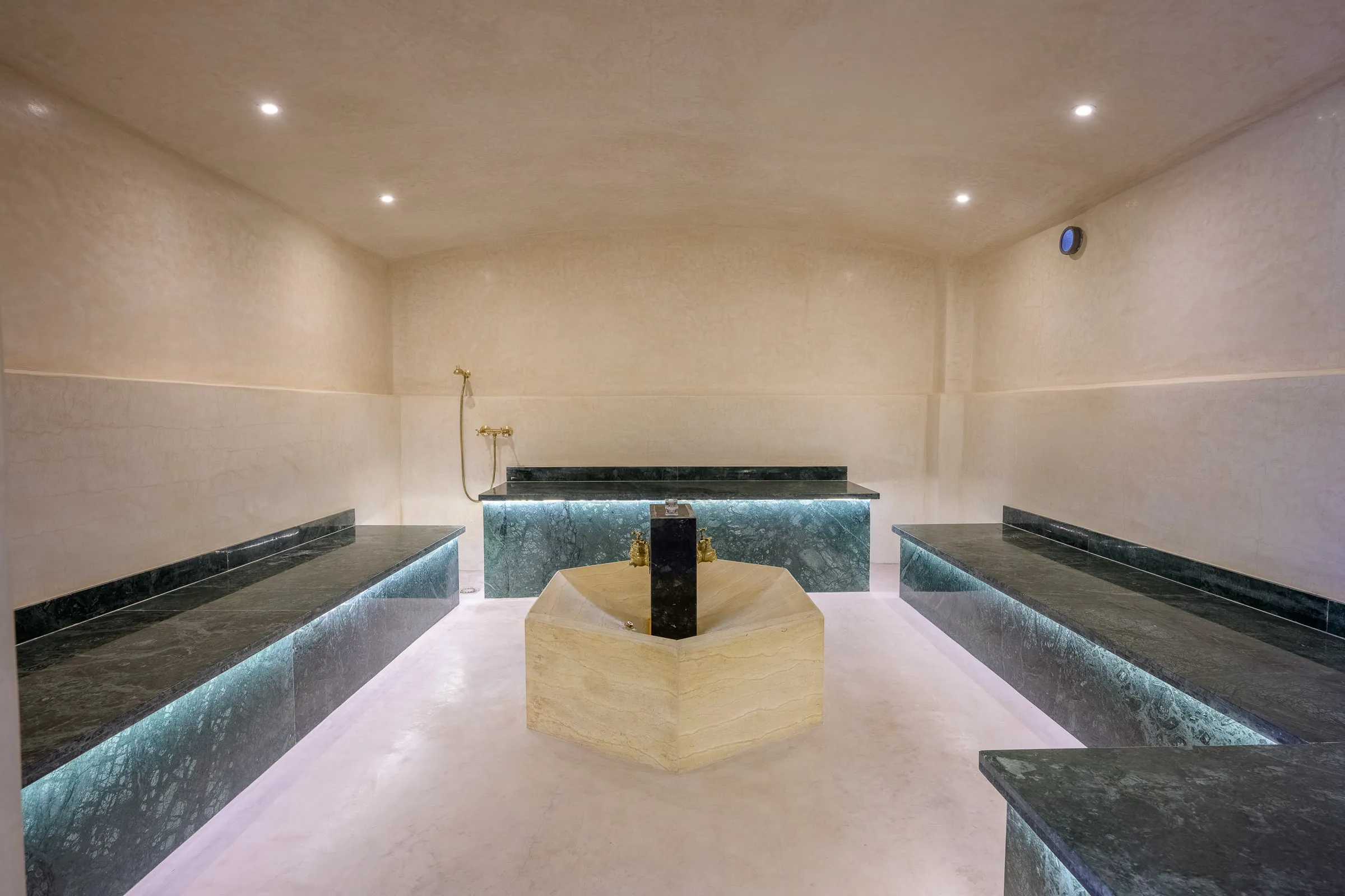 Villa Calypso, private villa rental in the Palmeraie, Marrakech: hammam with marble benches