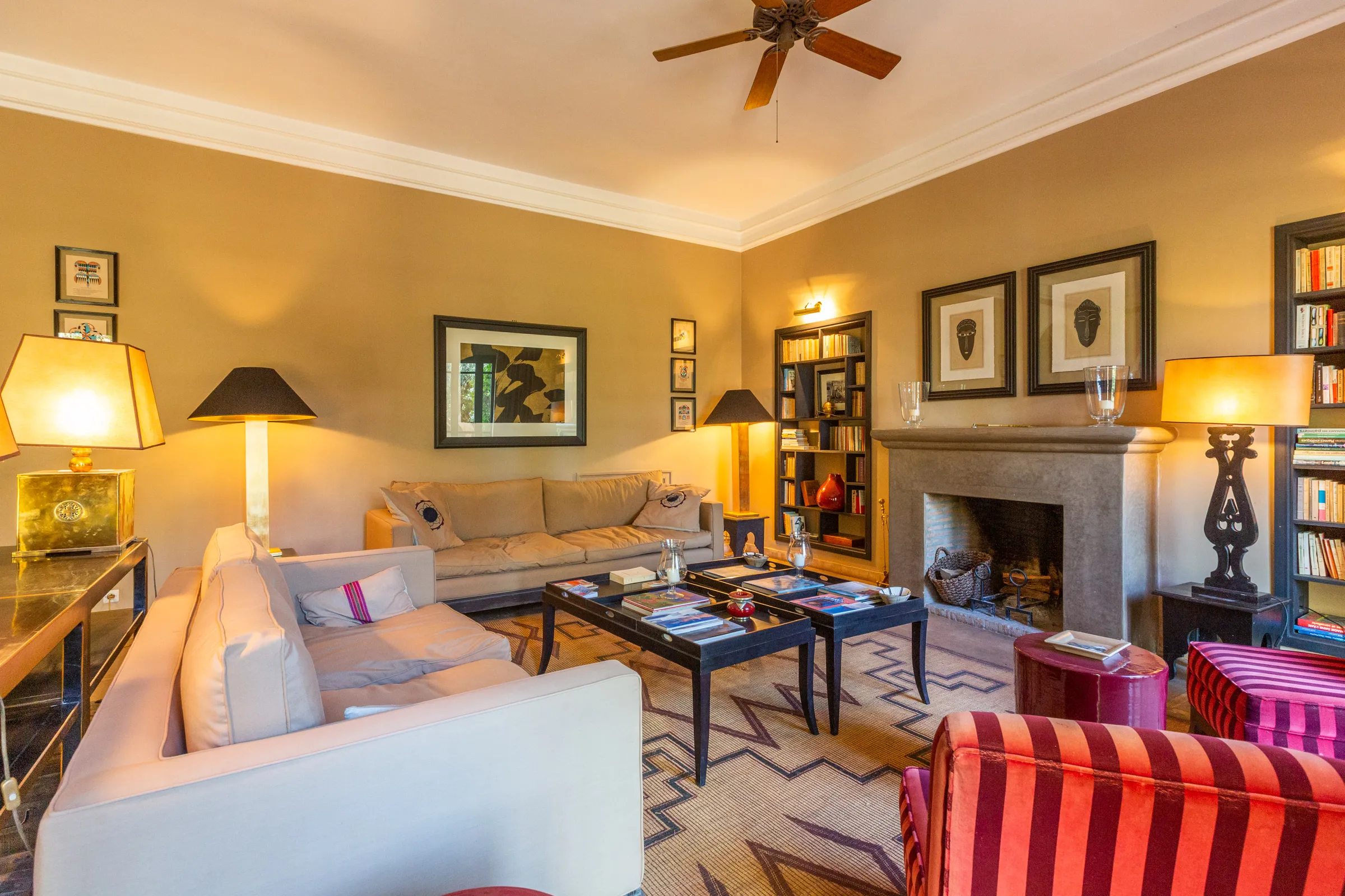 Villa Amalthea, private villa rental in the Palmeraie, Marrakech: library lounge with fireplace