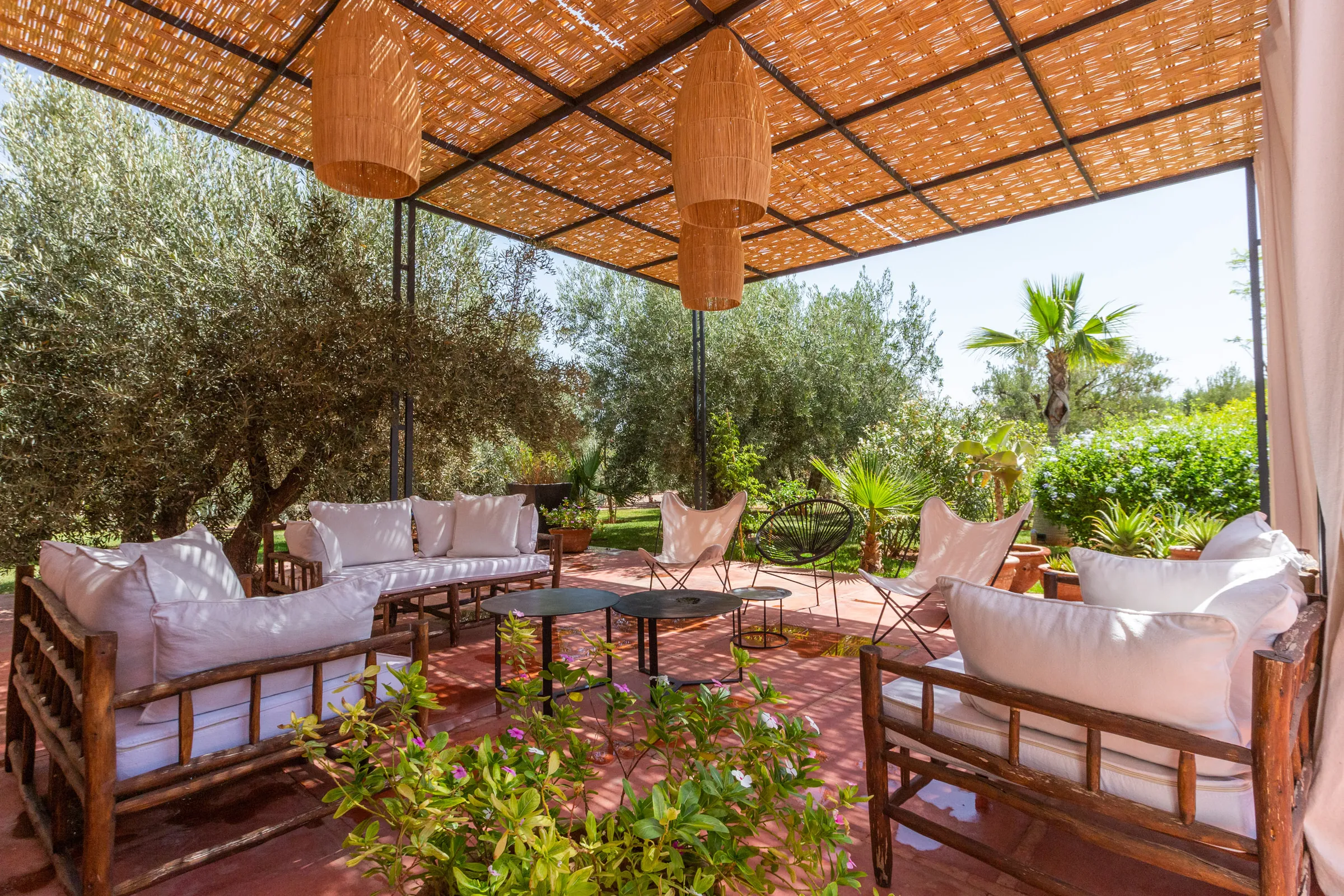 Villa Cassia, private villa rental on the Route de Tahanaout, Marrakech: shaded pergola lounge in the garden