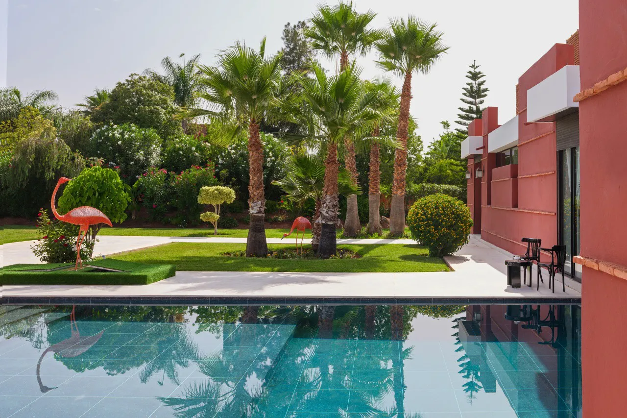 Villa Ersi, private villa rental on the Route de l'Ourika, Marrakech: pool and palm garden