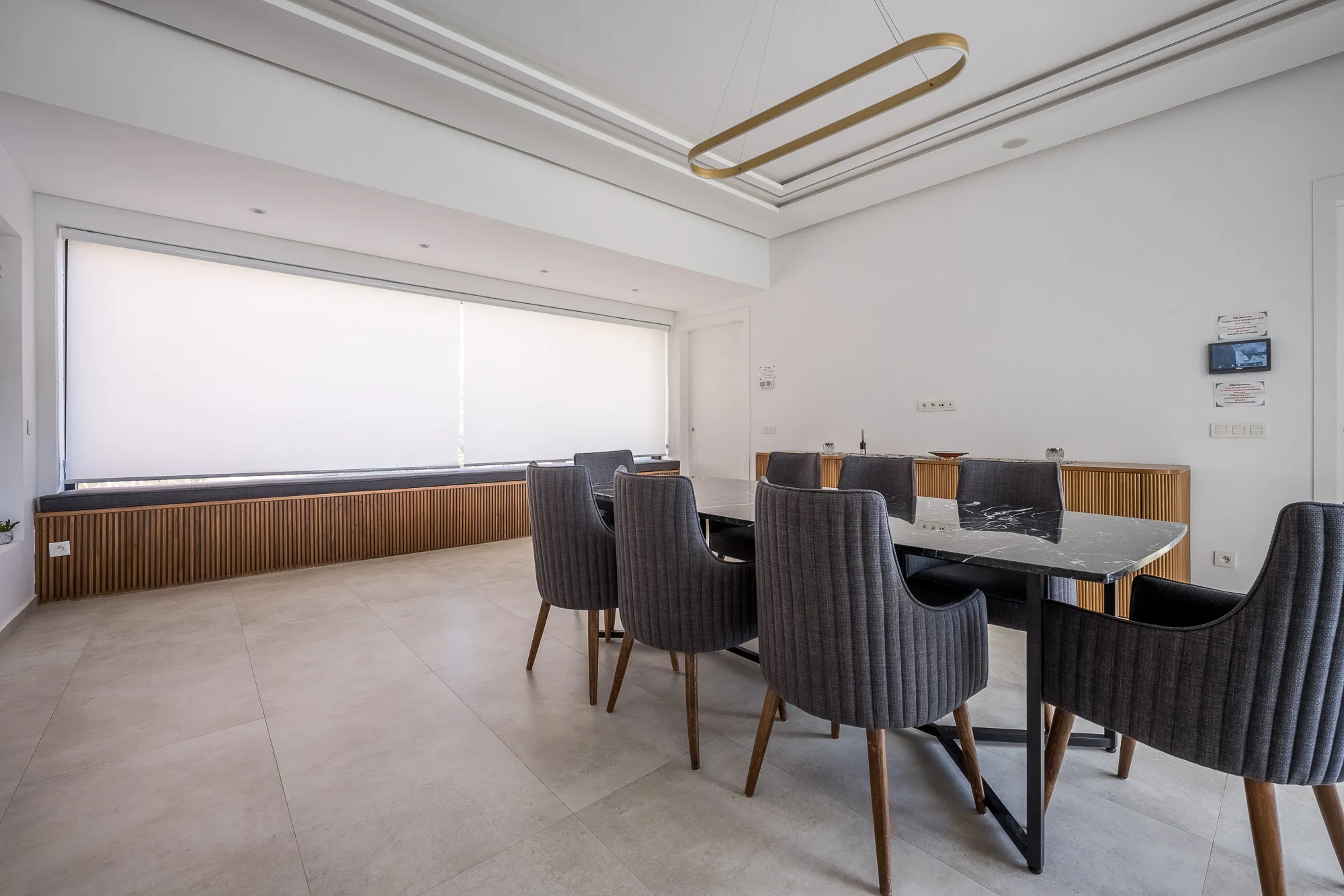 Villa Daphne, private villa rental at Amelkis Golf, Marrakech: dining room with marble table and upholstered chairs