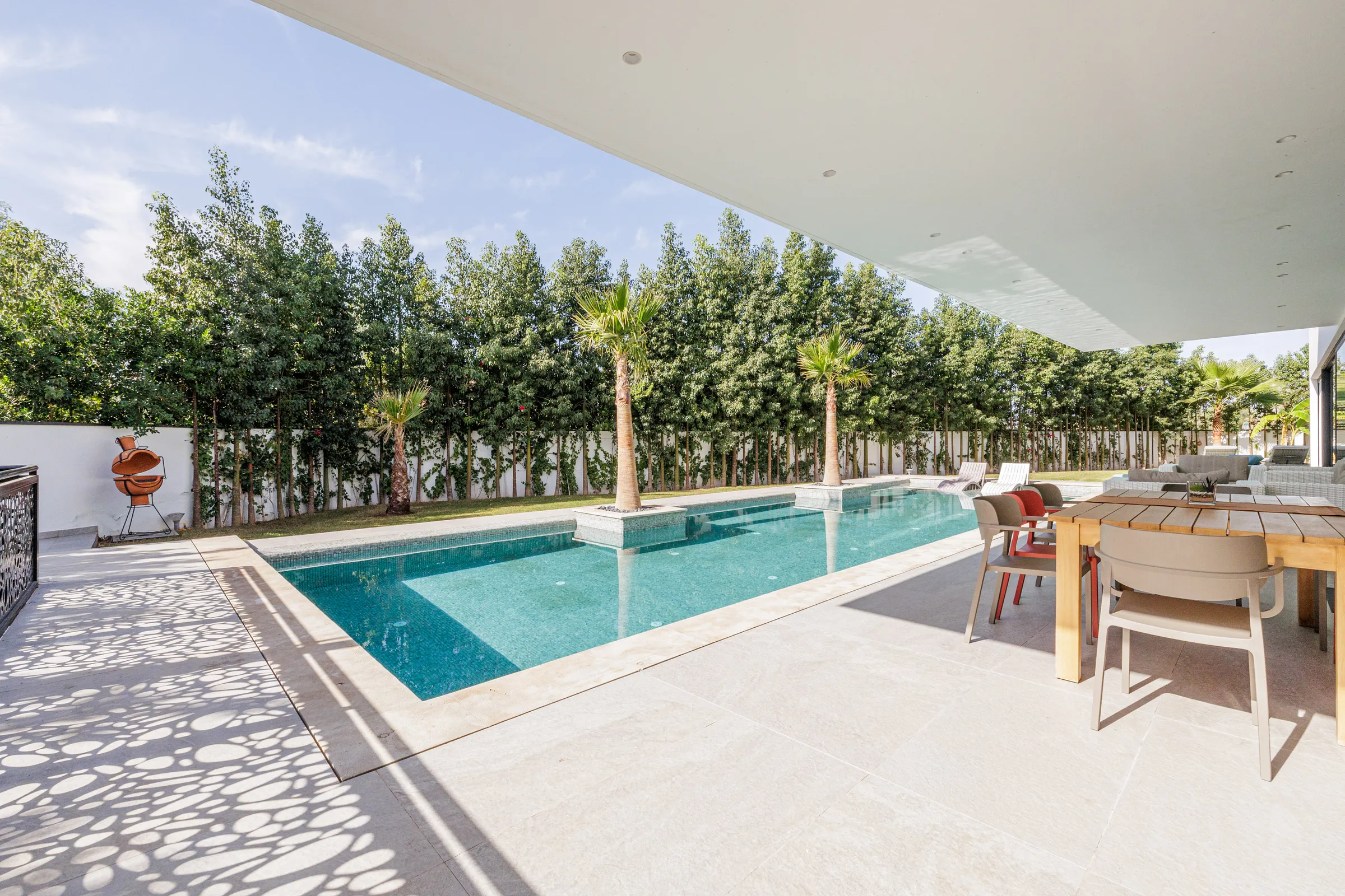 Villa Nefeli, private villa rental at Amelkis Golf, Marrakech: pool terrace with outdoor dining table