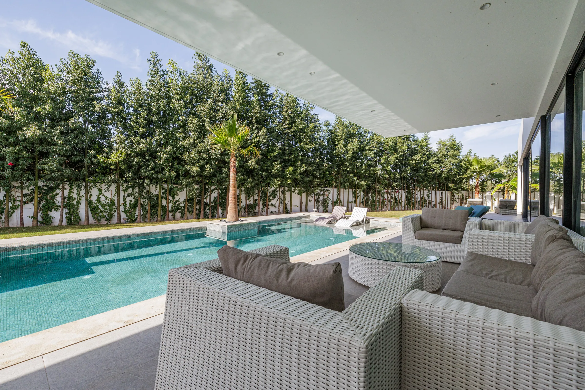 Villa Nefeli, private villa rental at Amelkis Golf, Marrakech: outdoor lounge sofa by the pool