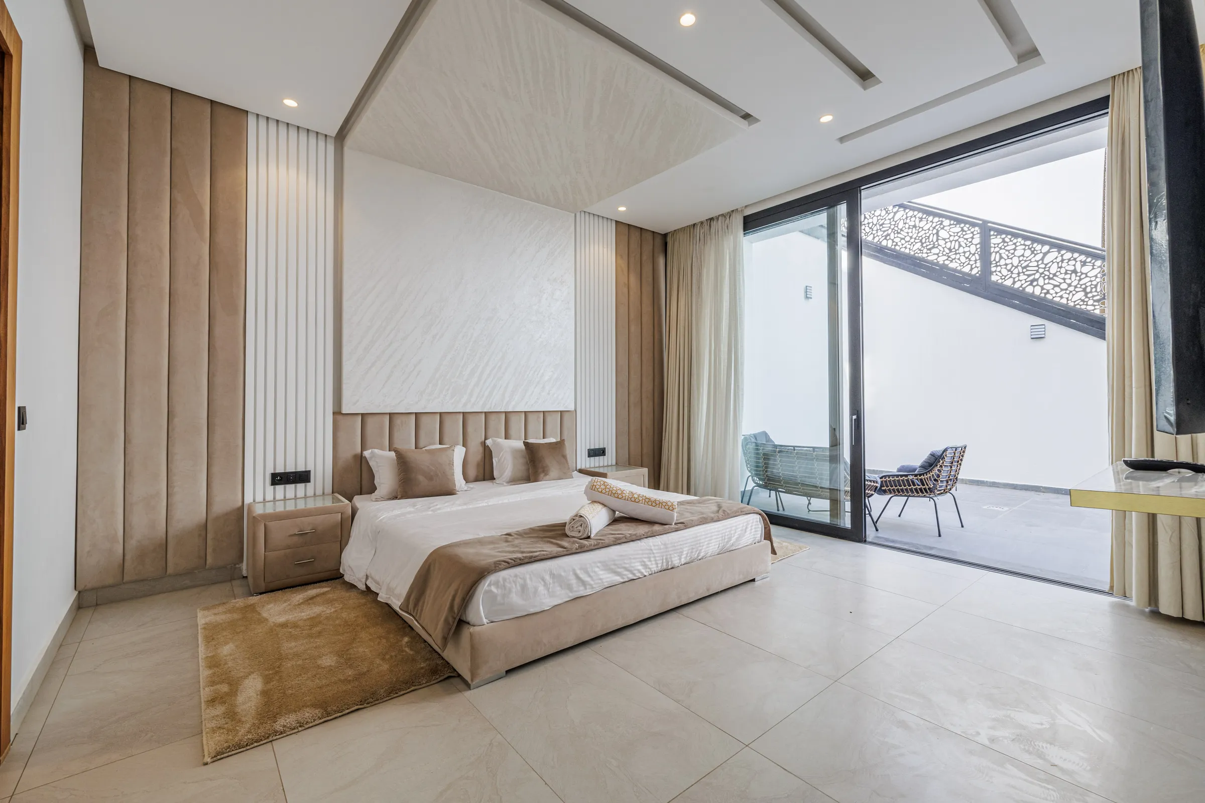 Villa Nefeli, private villa rental at Amelkis Golf, Marrakech: bedroom opening onto a terrace