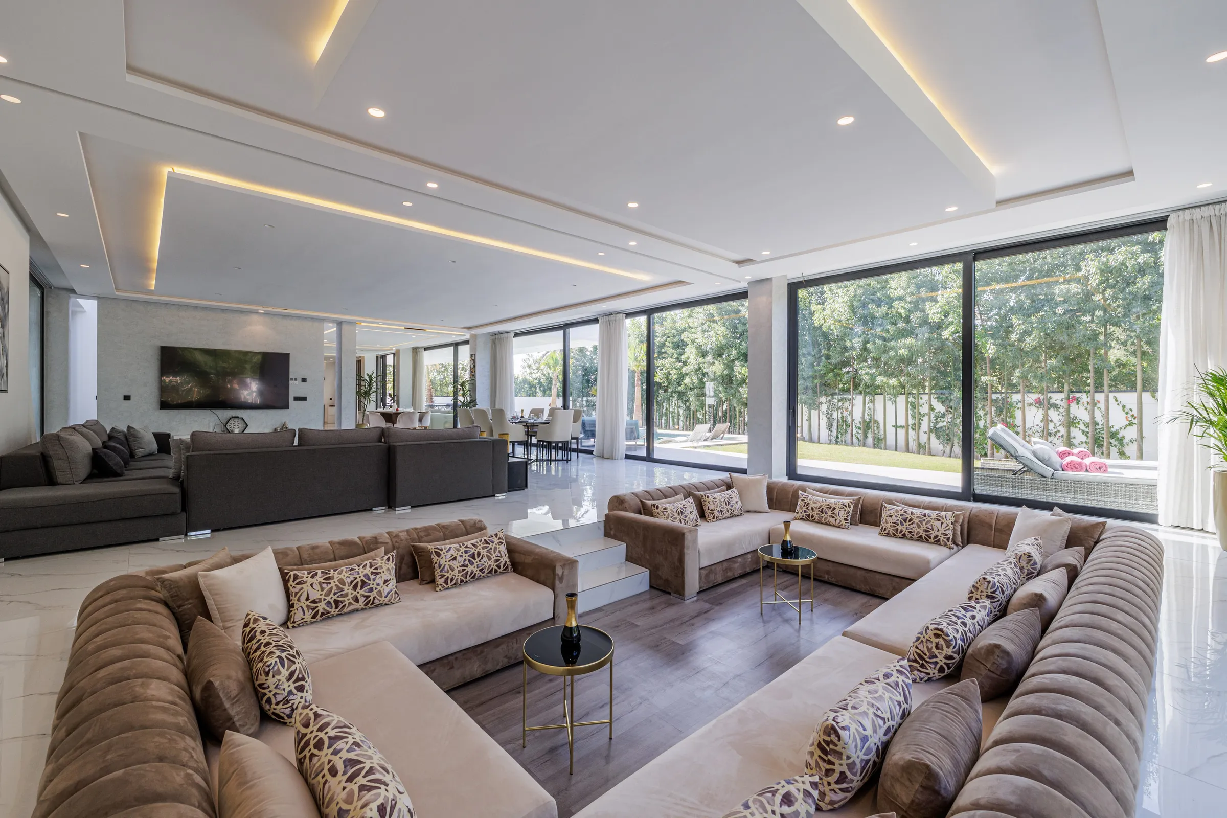 Villa Nefeli, private villa rental at Amelkis Golf, Marrakech: living room with large Moroccan-style sofas